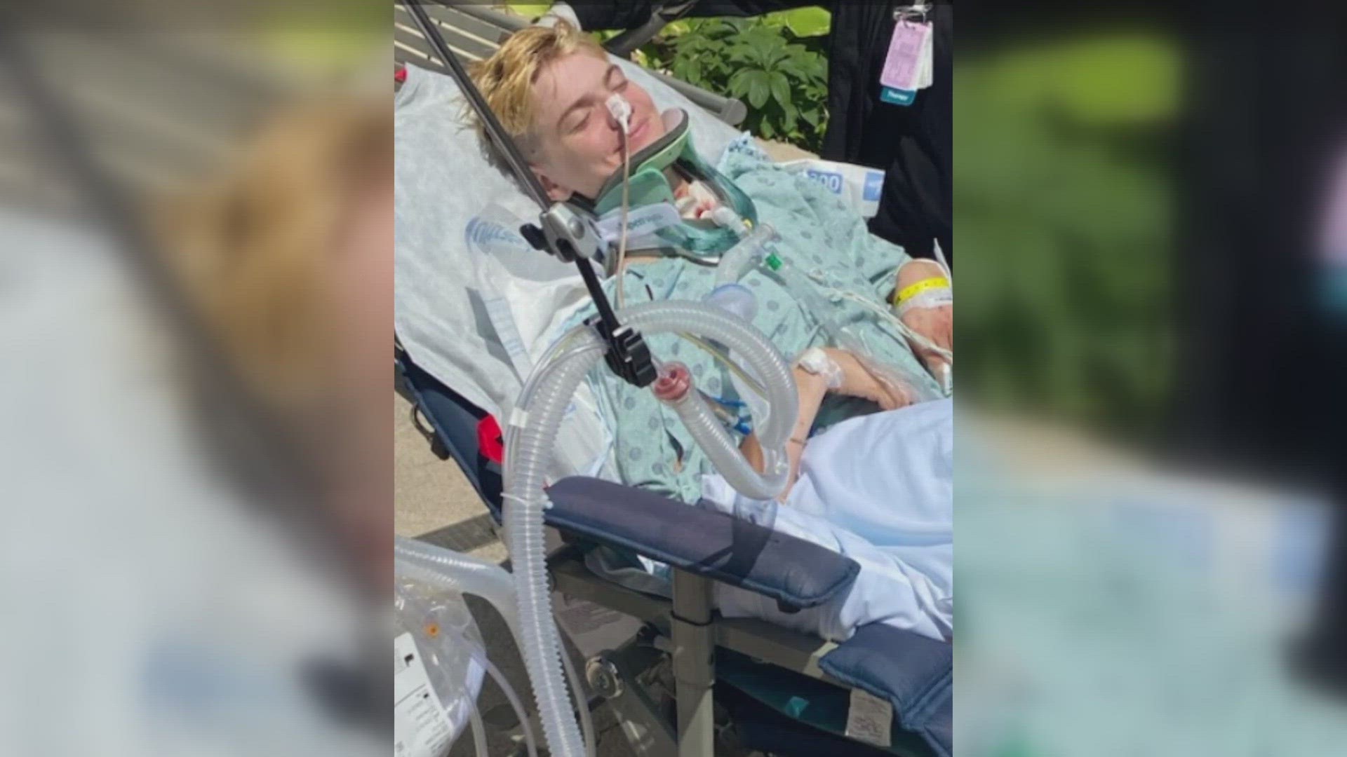 Jordan Ayers lay in a hospital bed on Tuesday, paralyzed from the waist down. The teen suffered a spinal cord injury when a stack of folding tables fell on him.