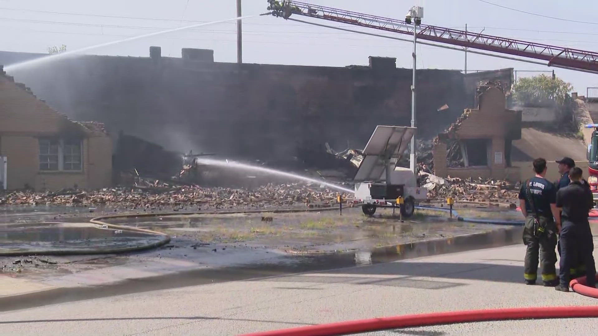 An abandoned warehouse caught fire Wednesday morning in St. Louis' Midtown neighborhood. The highway was closed due to the smoke, but has since reopened.