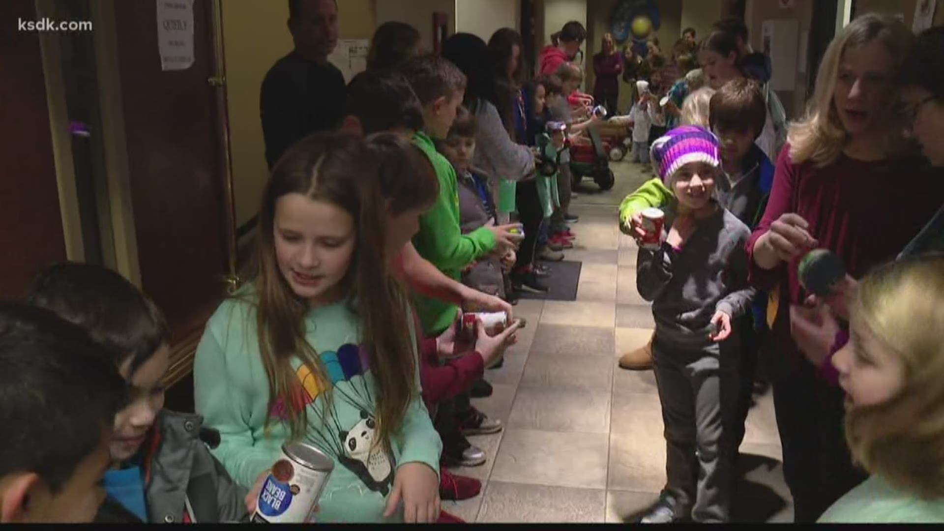 Elementary students in Webster Groves kicked off the season of giving by hand delivering thousands of food products to a local church.