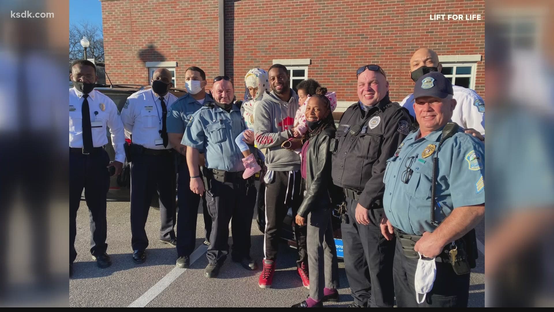 Officer Jamez Knighten was surprised with a car and a community hero award during a recent moment commemorating the anniversary of his heroic act