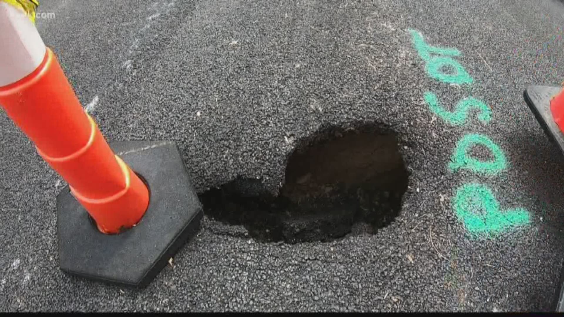 What started out as a slight dip in the road has since developed into a large and deep hole right in the middle of a busy residential street.