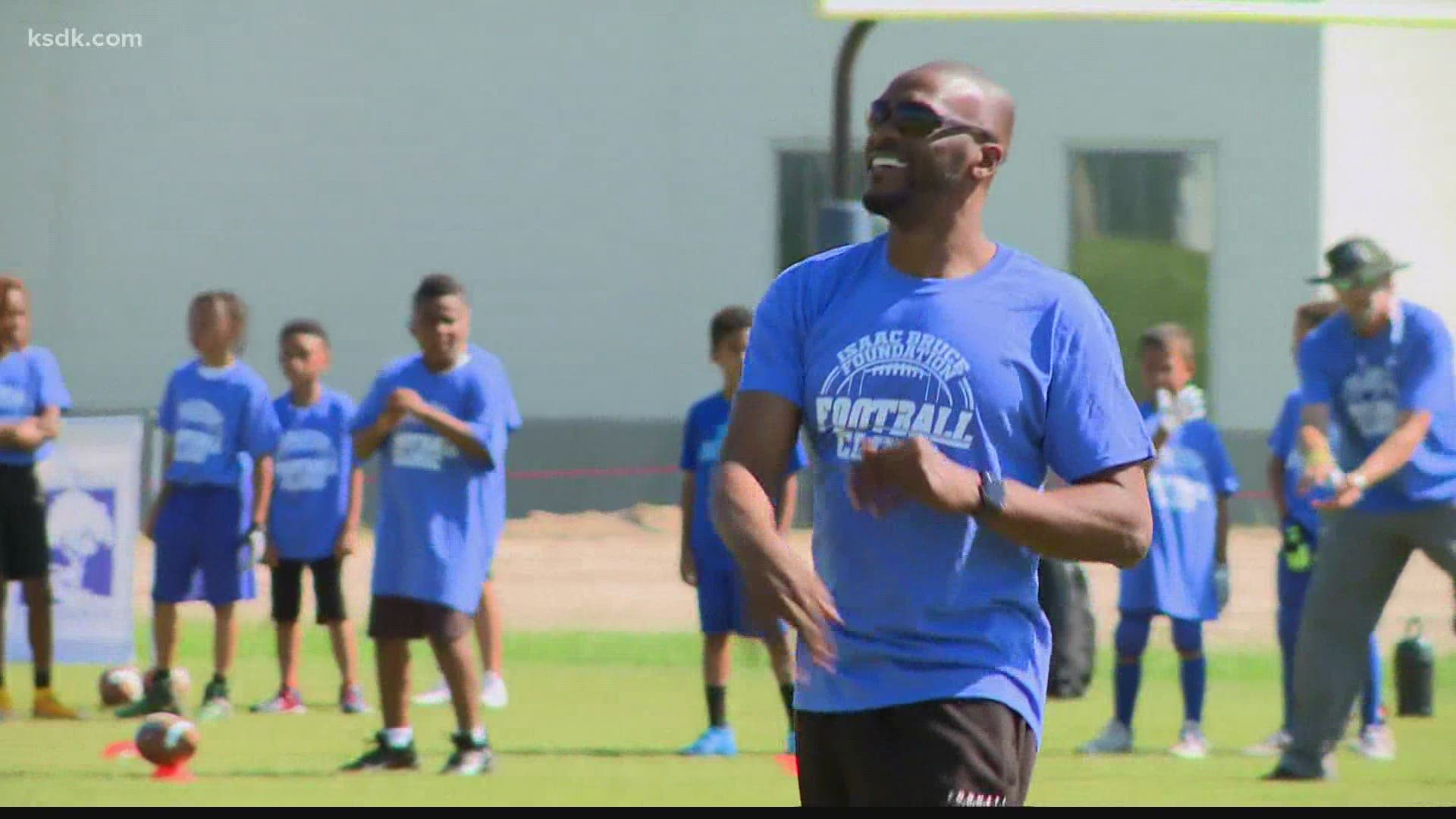 Rams Hall of Fame receiver says hosting his annual youth football camp is the least he can do