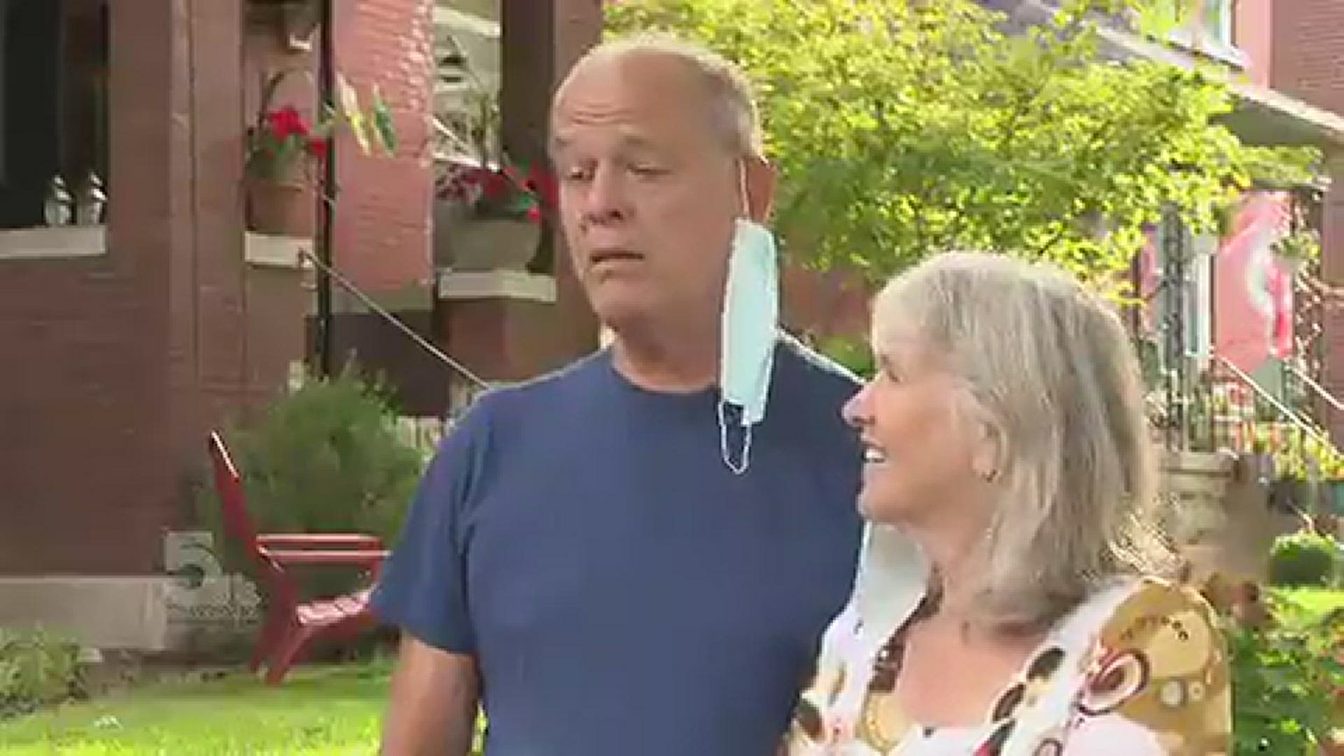 Steven and Mimi say a gunman walked in their front door demanding they stop calling police after a man was yelling for help in their alley