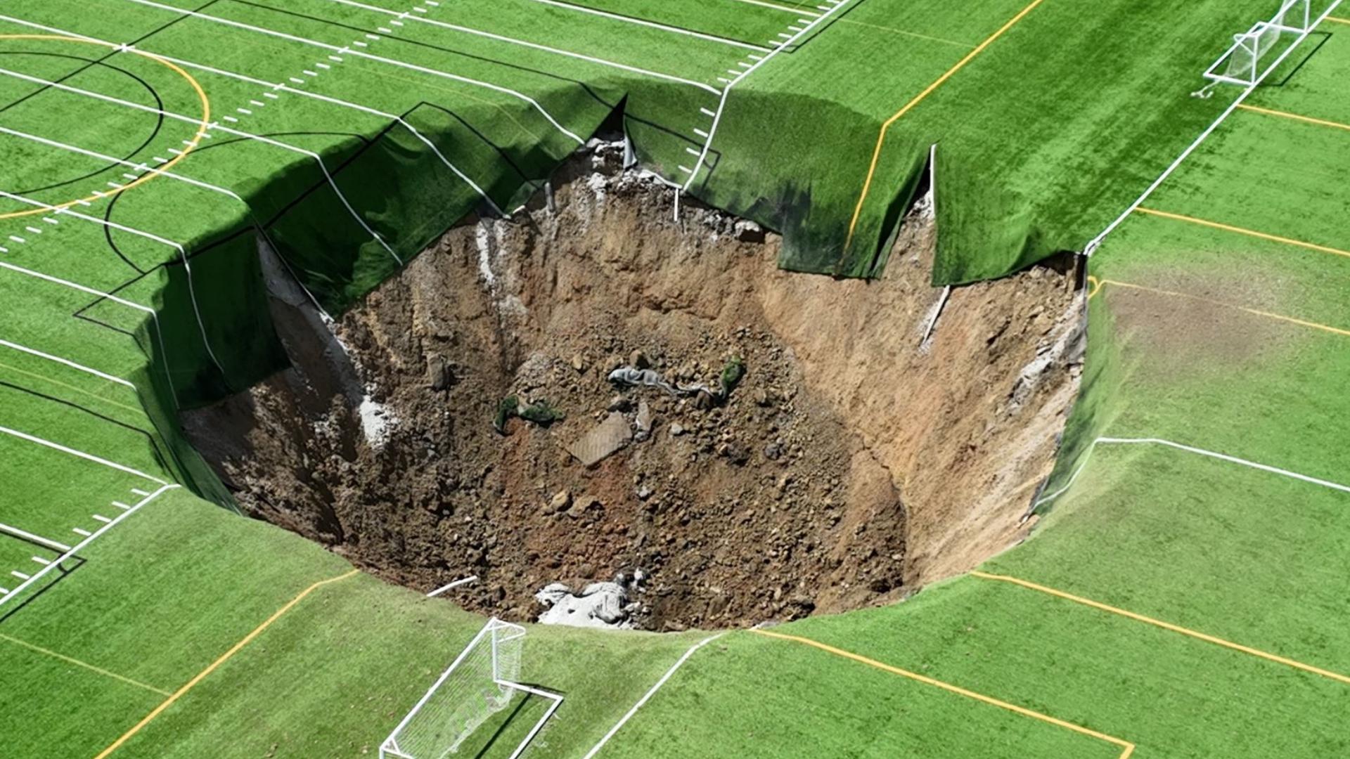 A sinkhole opened up at the soccer fields at Gordon Moore Park in Alton, Illinois on Wednesday. Drone video shows the aftermath of the sinkhole.