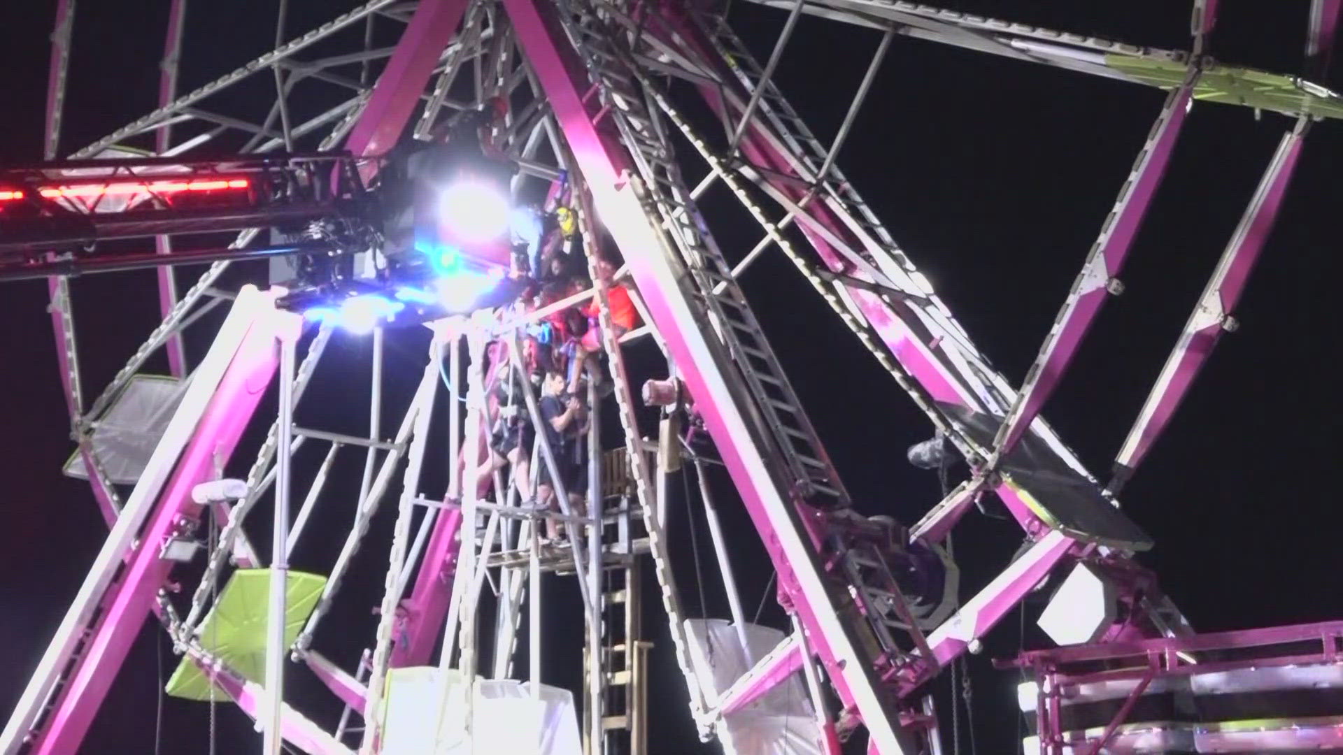 The worker was helping dismantle the Ferris wheel when a section of the ride collapsed and trapped him 45 feet in the air. The man is expected to be OK.