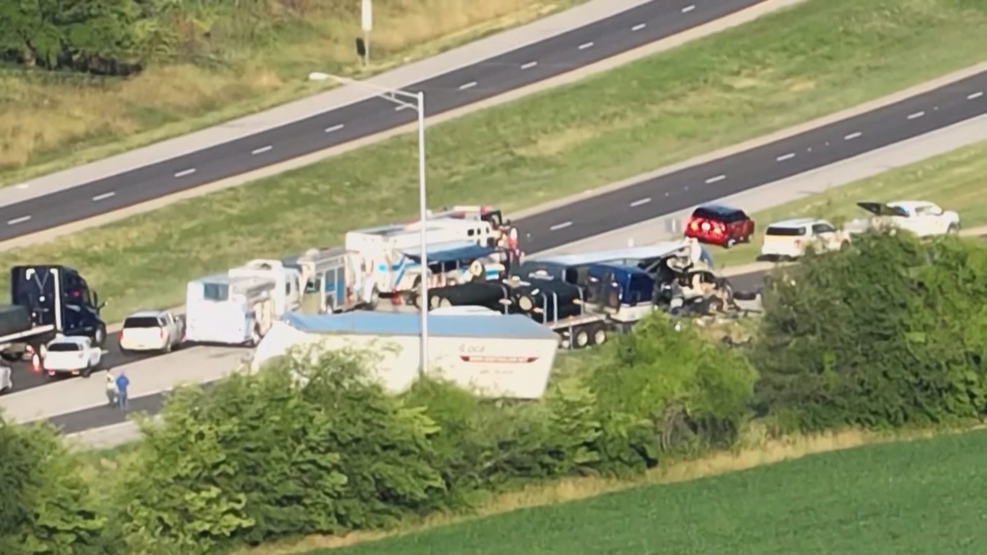 According to Illinois State Police, a Greyhound bus was carrying passengers westbound on I-70 when it struck three commercial vehicles.