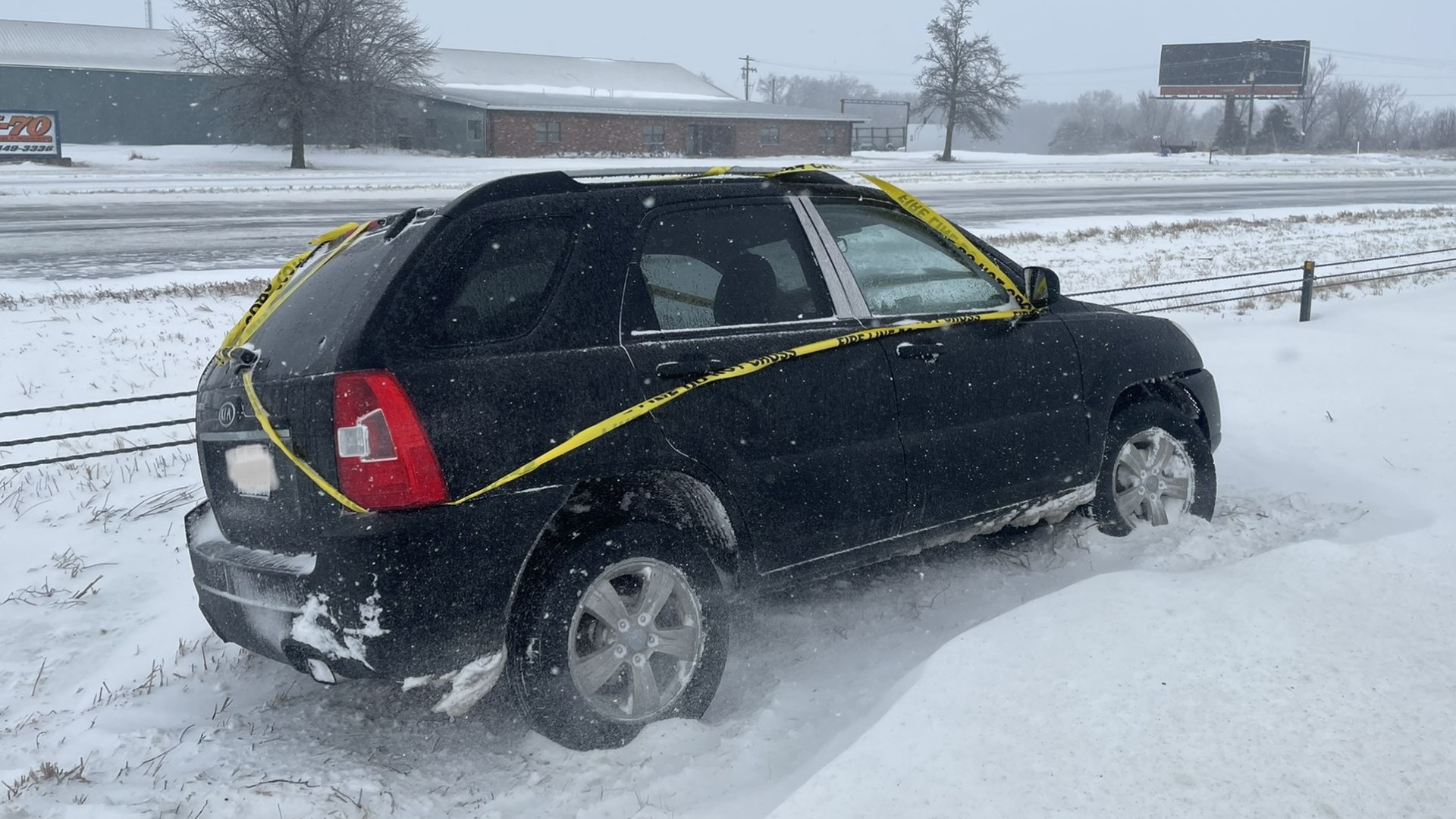 Wintry weather can lead to rough road conditions. If you see a car trapped on the side of the road, check to see if it has caution tape or an orange sticker on it.