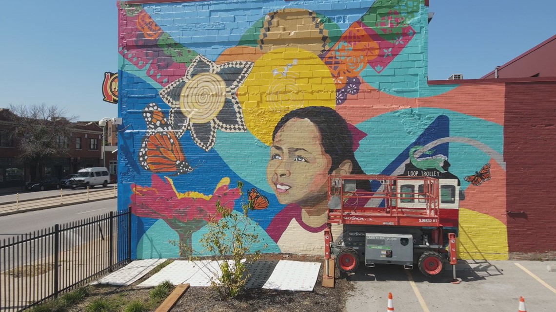 Hispanic artists create mural in St. Louis for heritage month | ksdk.com