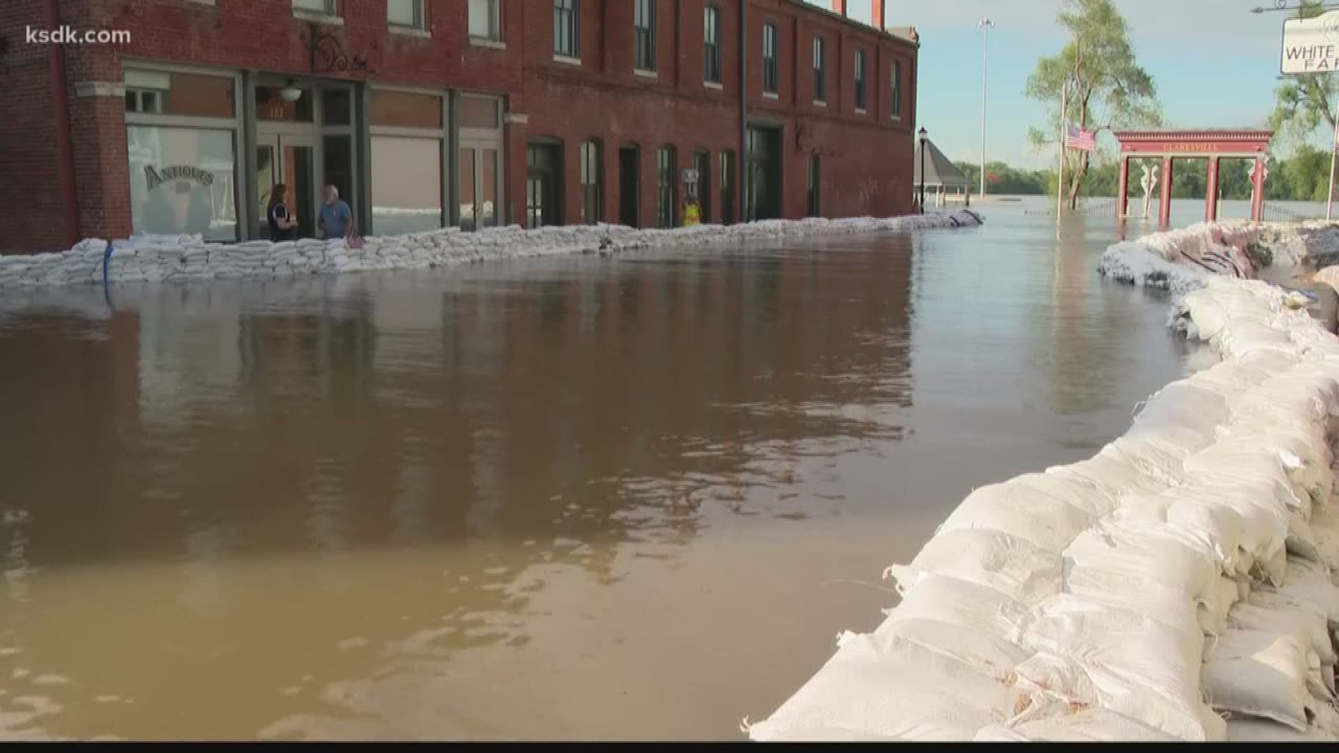 In Clarksville, crews are working all night long to add more sandbags to the wall protecting the historic town.