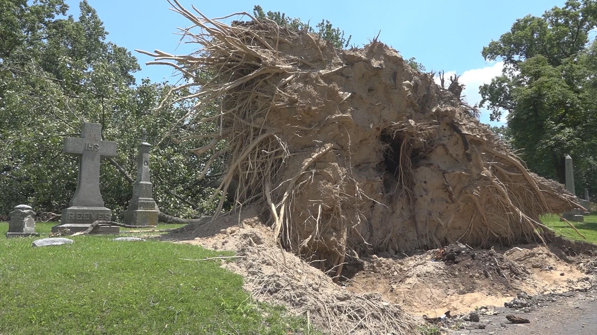 Nine days ago, storms devastated the St. Louis area. Cleanup continues at two of the area's largest cemeteries.