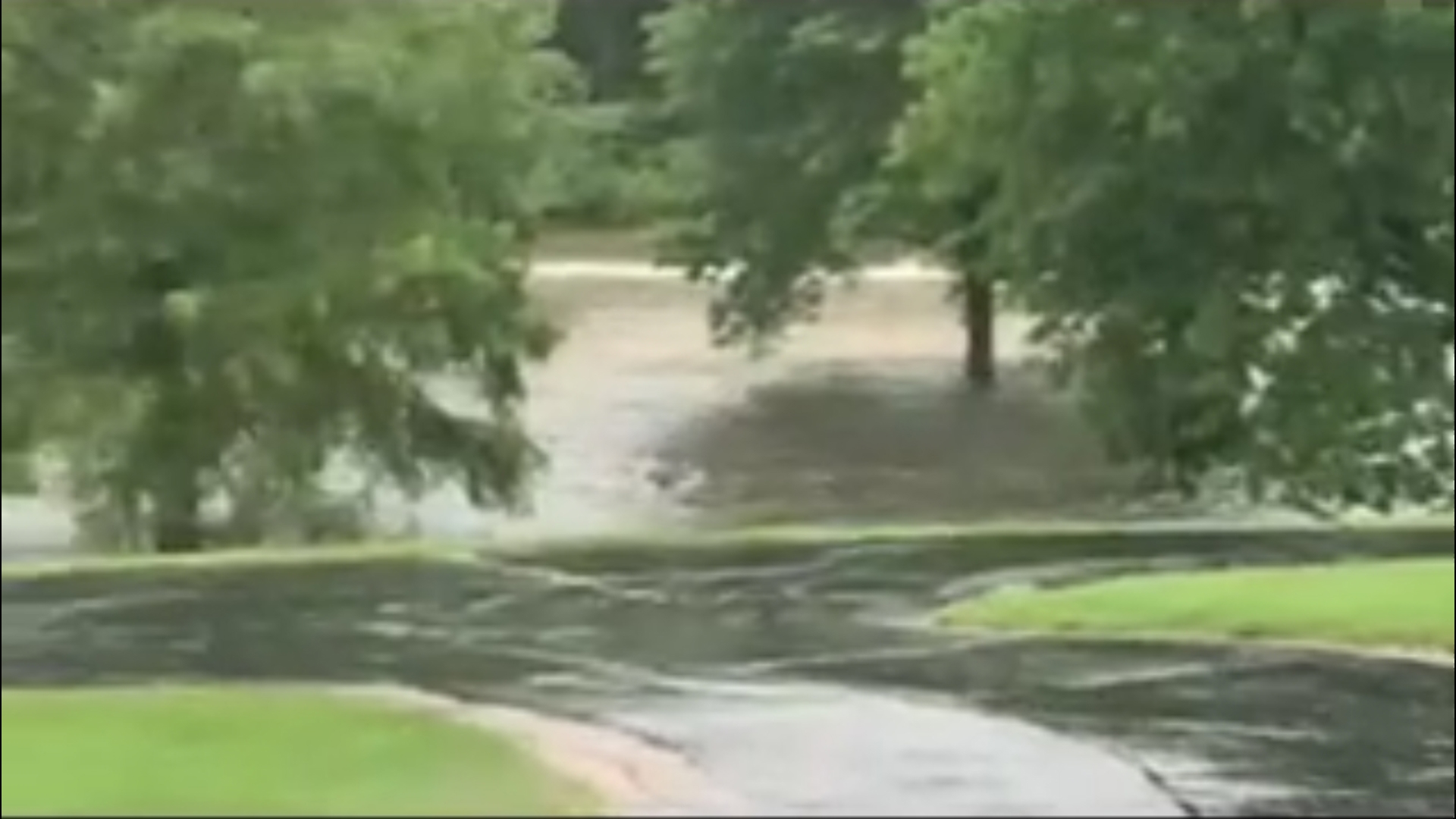 Video shows water flowing below the dam failure in Nashville, Illinois ...