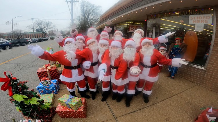 Dancing Santas spread holiday spirit through streets of St. Louis