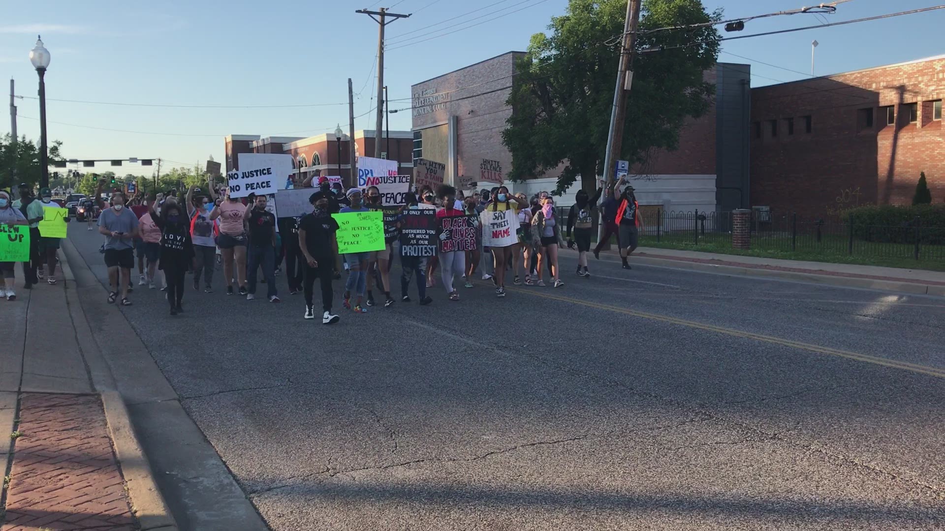 After chanting rallying cries like "Black lives matter" and “What’s his name? George Floyd,” protesters began marching down South Florissant Sunday evening.