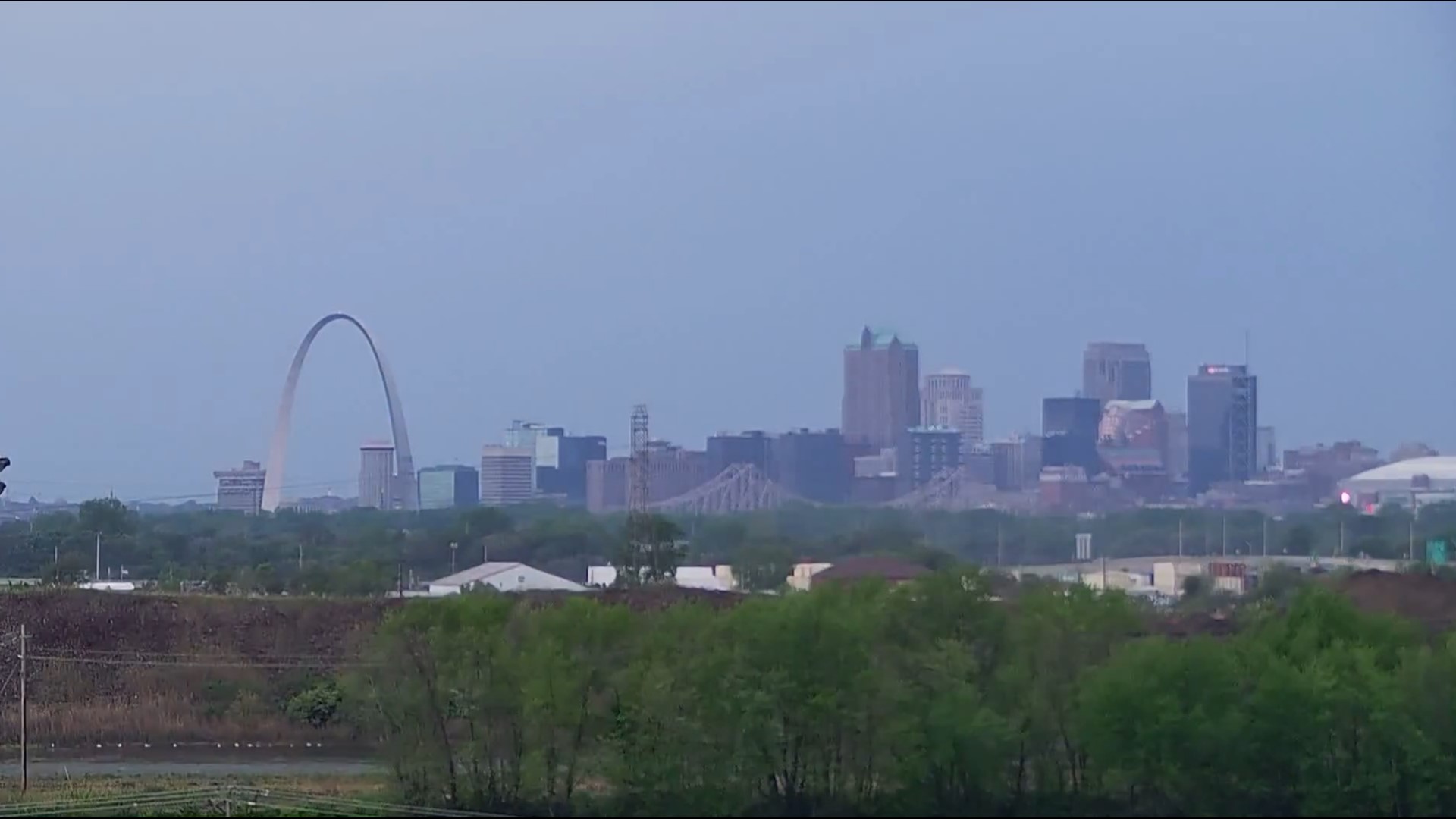 A timelapse shows the Gateway Arch and the downtown St. Louis skyline as a storm rolls through. The camera turns and shows World Wide Technology raceway.