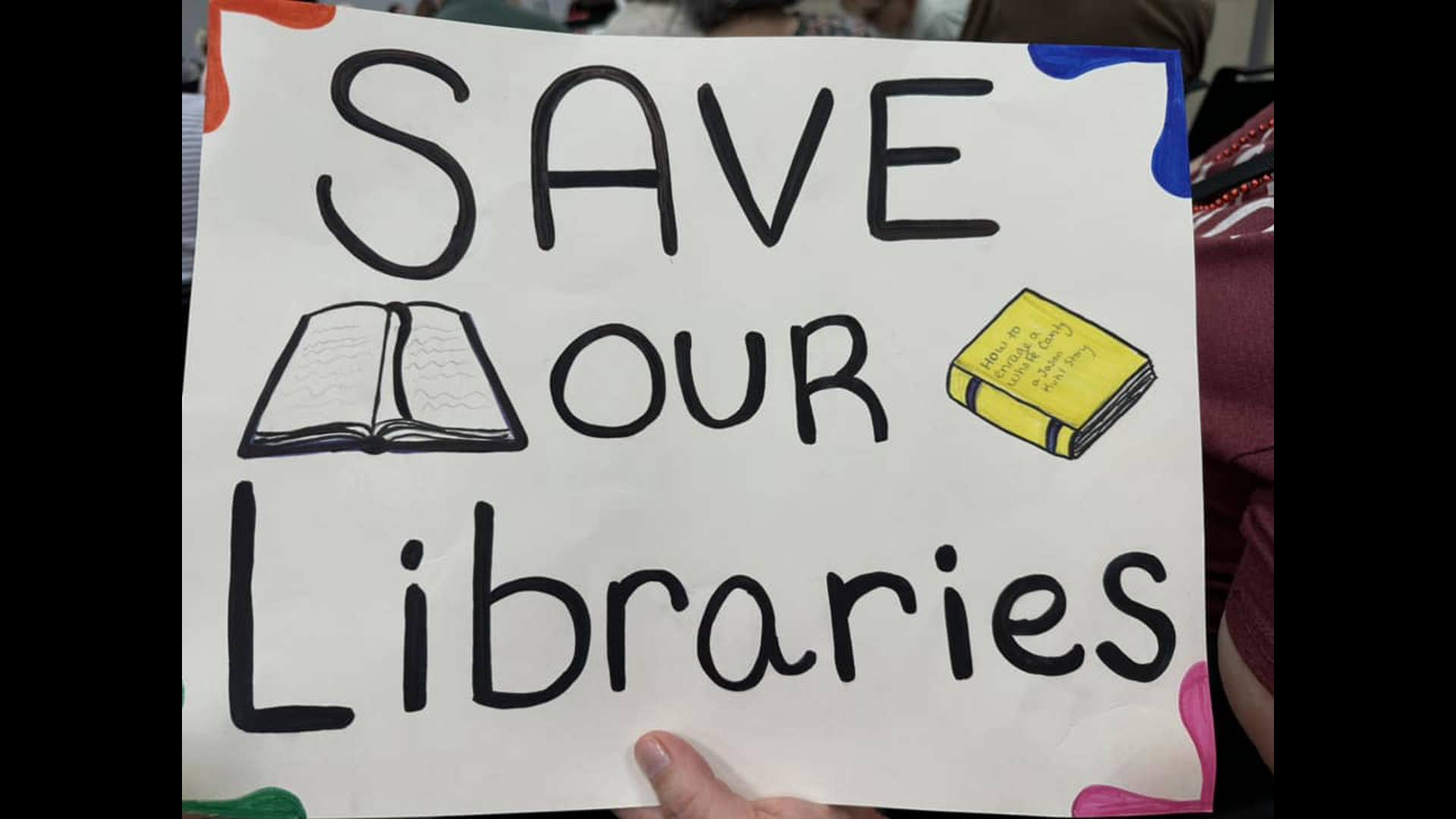 Protesters gathered outside the newly renovated Spencer Road library branch on June 11th.