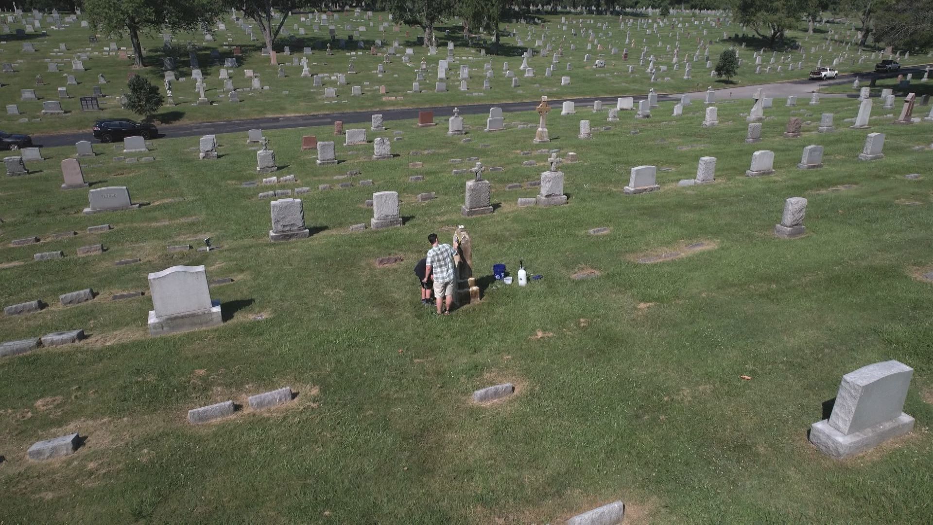 Father, son clean headstones at Cavalry Cemetery | ksdk.com