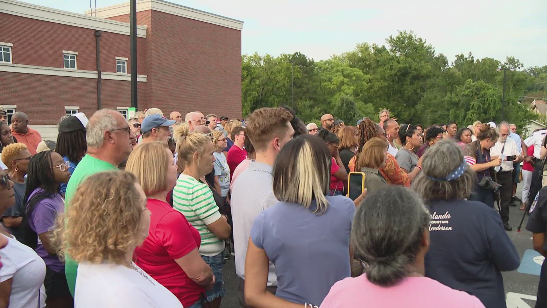 Hundreds packed the Ferguson Police Department parking lot Tuesday evening to pray for the recovery of Officer T.J. Brown. Brown remained in a coma as of Tuesday.