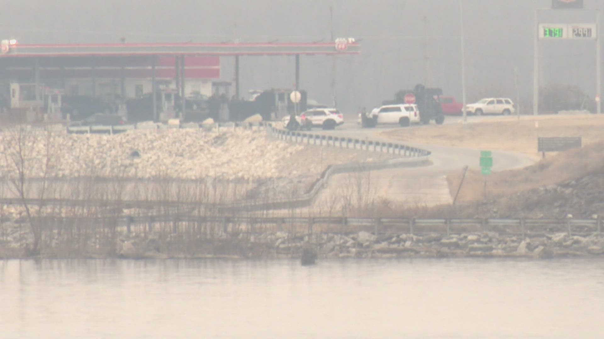 Police have closed two St. Louis-area bridges after a person of interest in a homicide refused to talk with police.