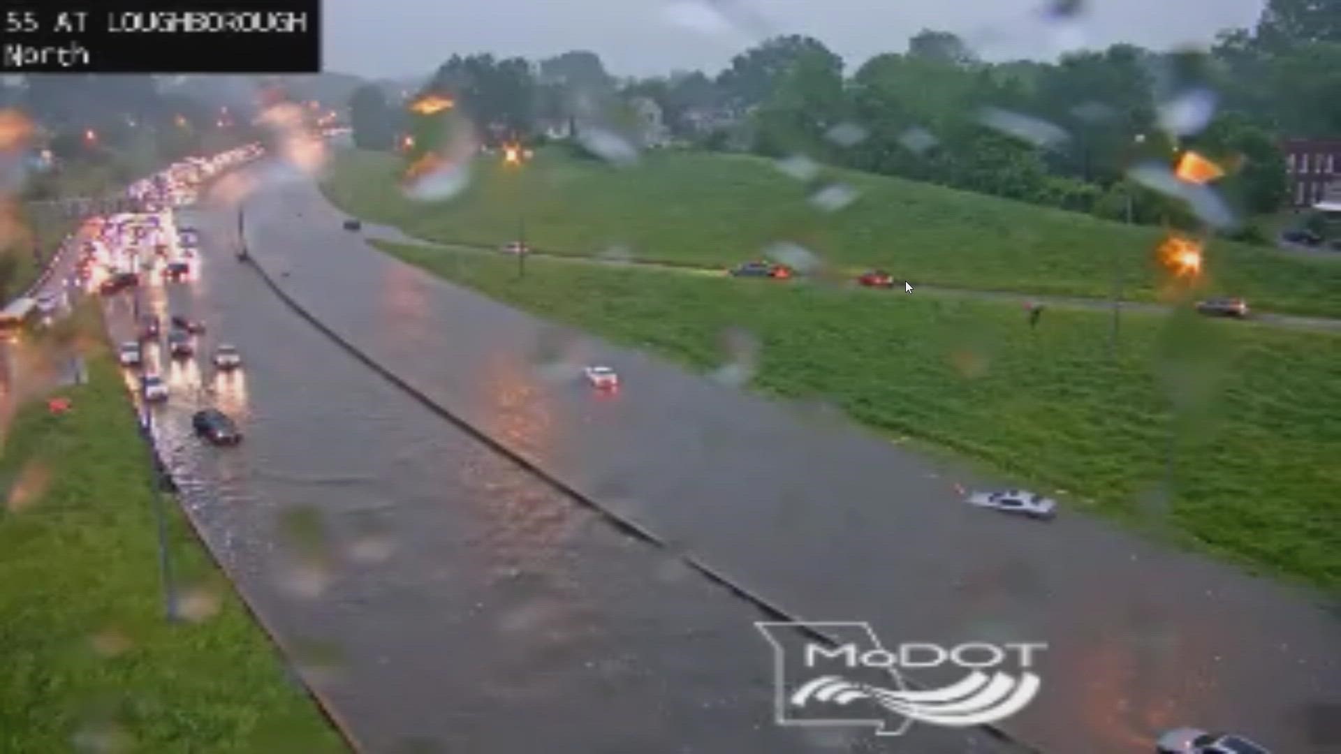 Cars were stranded on the interstate after heavy rain. The interstate was impassable.