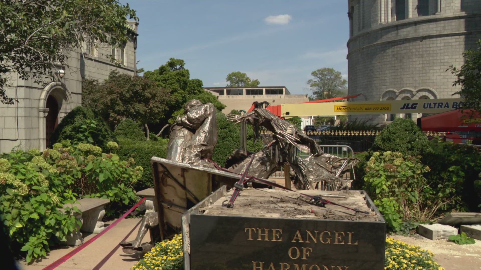 A man was taken into custody after police said he broke into construction equipment and damaged a statue Tuesday night outside the Cathedral Basilica.