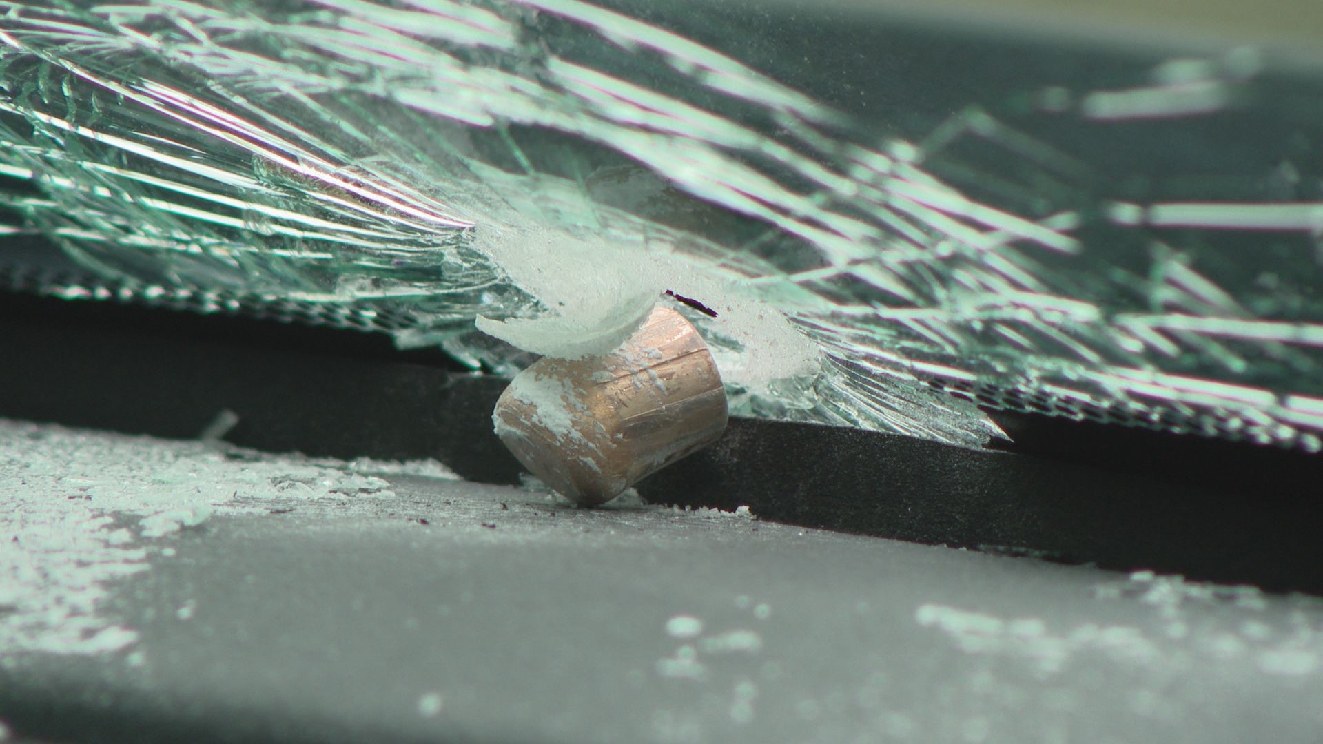 William Mason filed a police report. He said police told him a 9 mm bullet struck and was wedged in his windshield.