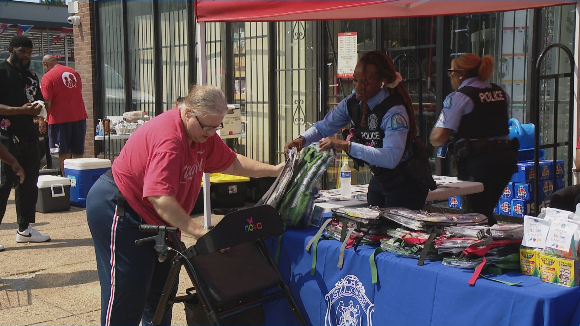 St. Louis police gives away school supplies, safety tips and gun locks before school starts