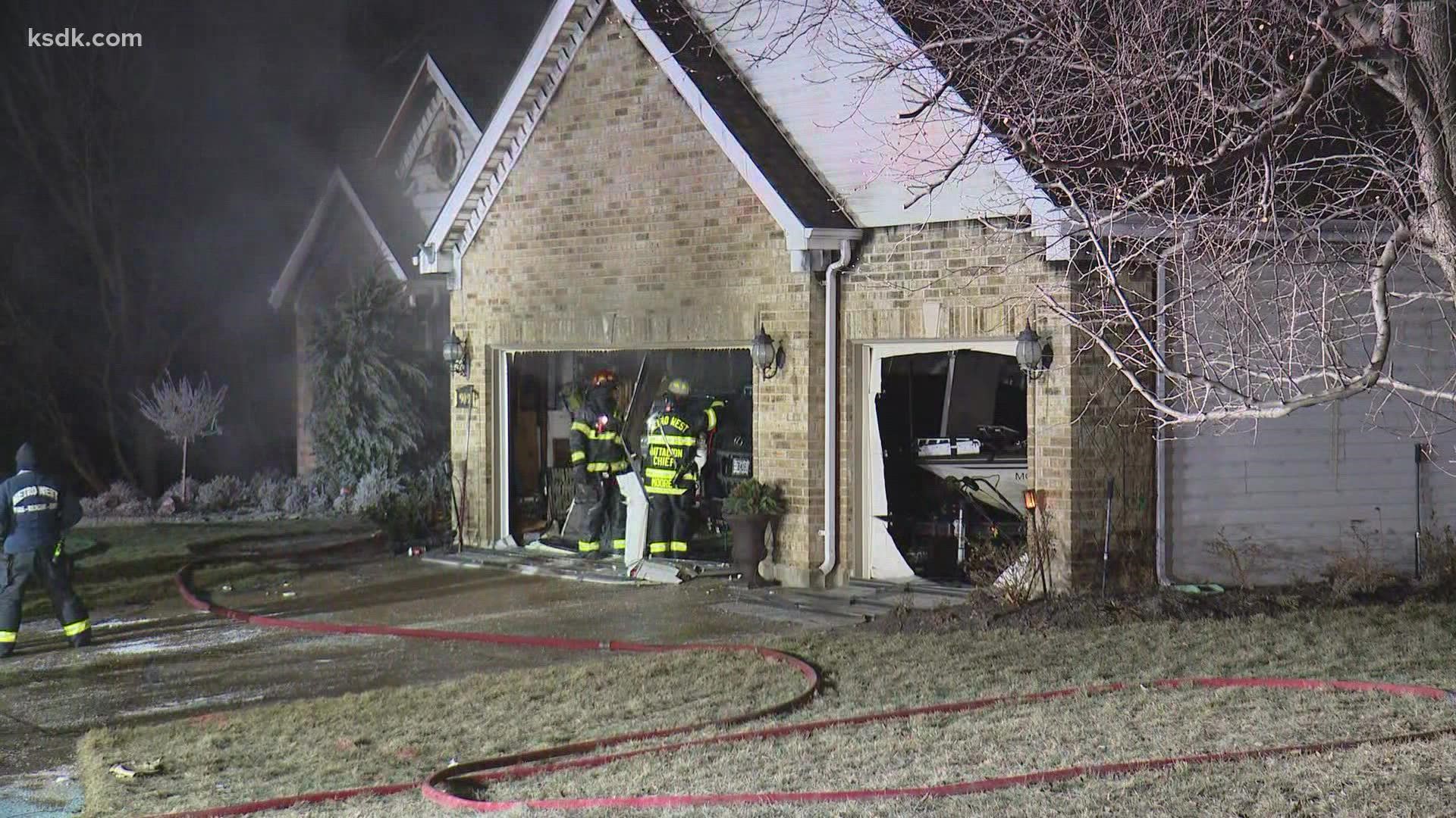 A couple lived in the home and got out safely. Firefighters say the fire started in the basement after a boom was heard.