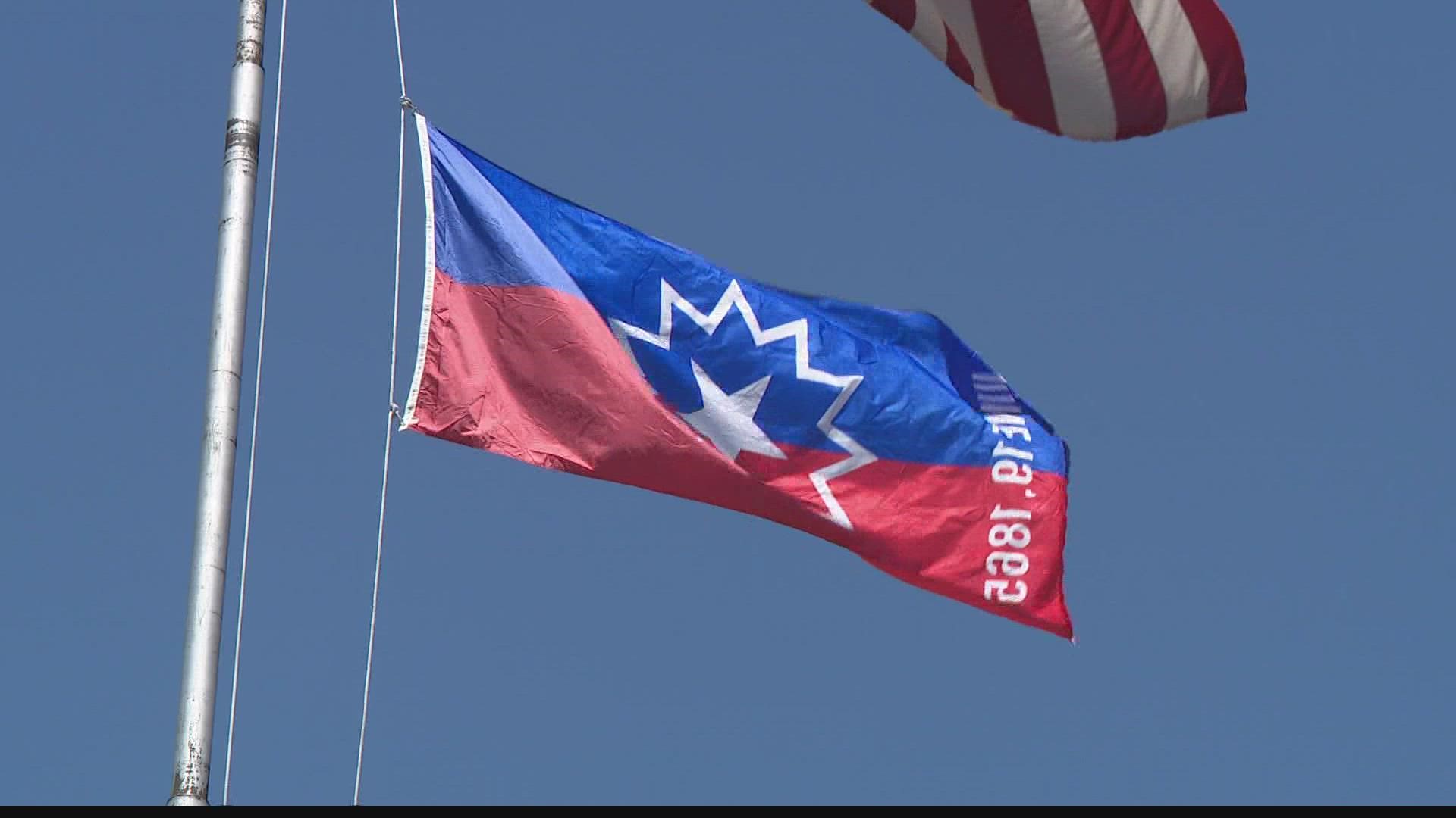 A red and blue flag with a white bursting star was raised high at St. Louis City Hall to commemorate the Juneteenth on Friday. It honors the historic end of slavery.