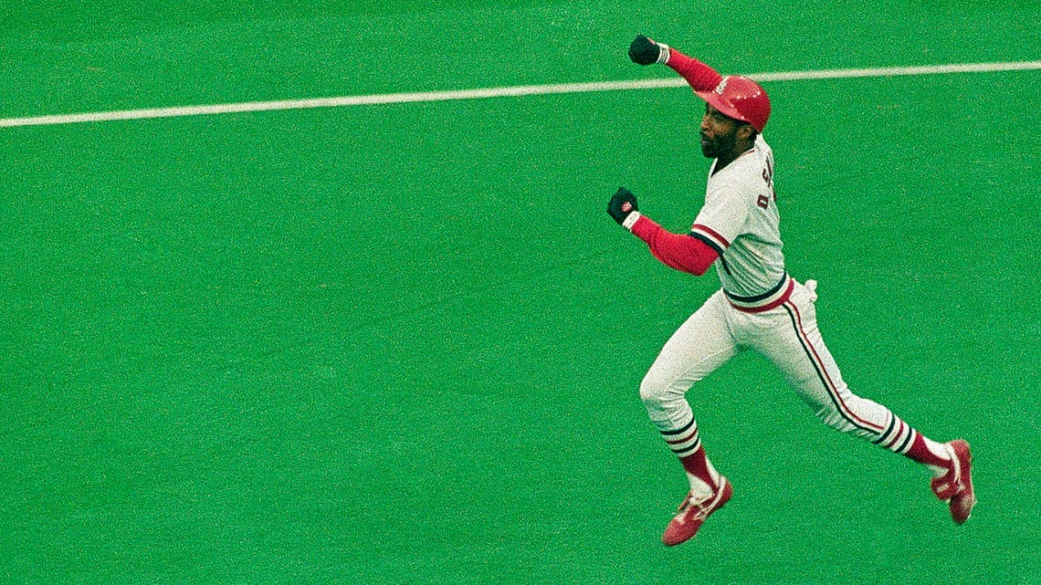 St. Louis Cardinals Hall-of-Famer Ozzie Smith gestures to his longtime  friend and teammate, assistant coach Willie McGee, on the Cardinals bench  before a baseball game between the Cardinals and the Kansas City