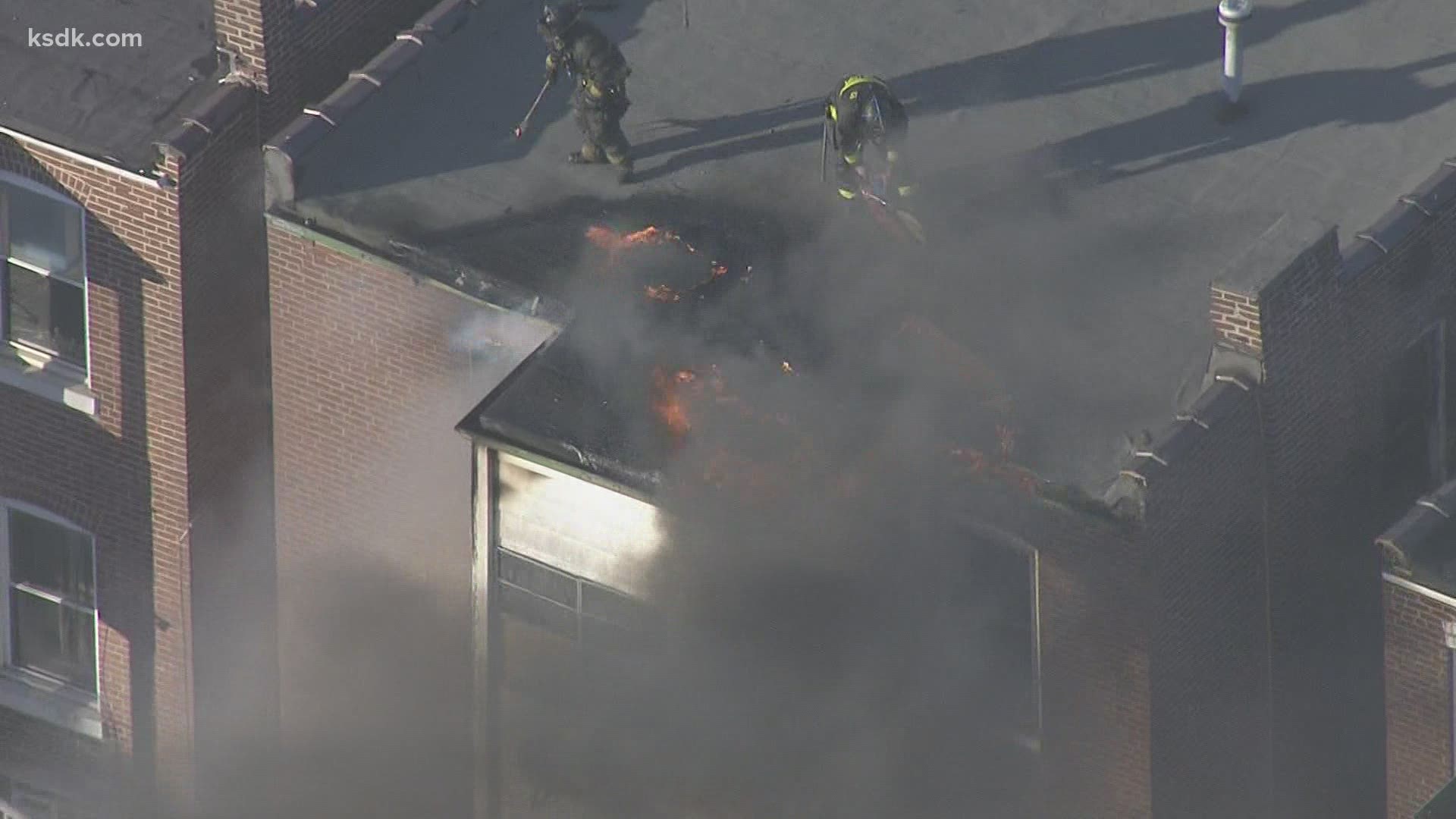 You can see flames and smoke coming from the building near Fairground Park