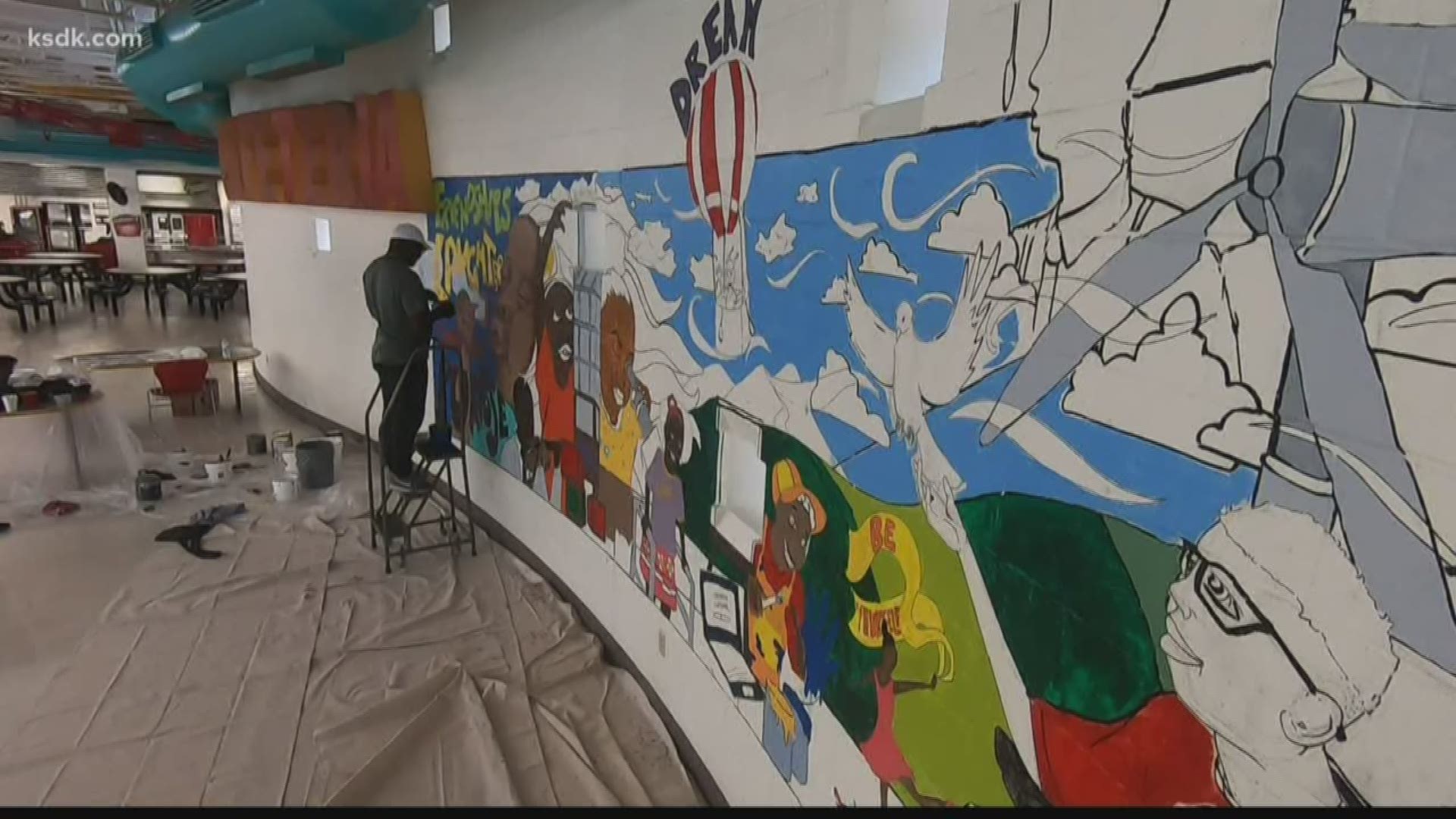 Local artist paints mural to inspire students