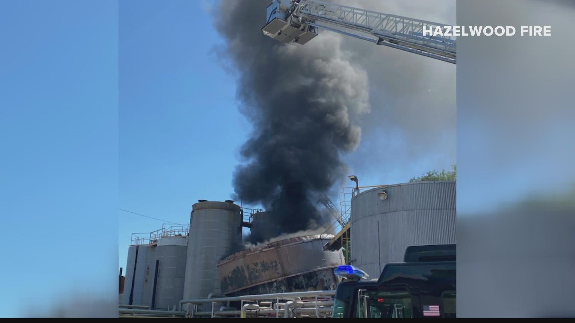 Employees at the asphalt company were offloading tar when a spark ignited a fire inside the tank. Heavy smoke could be seen for miles.