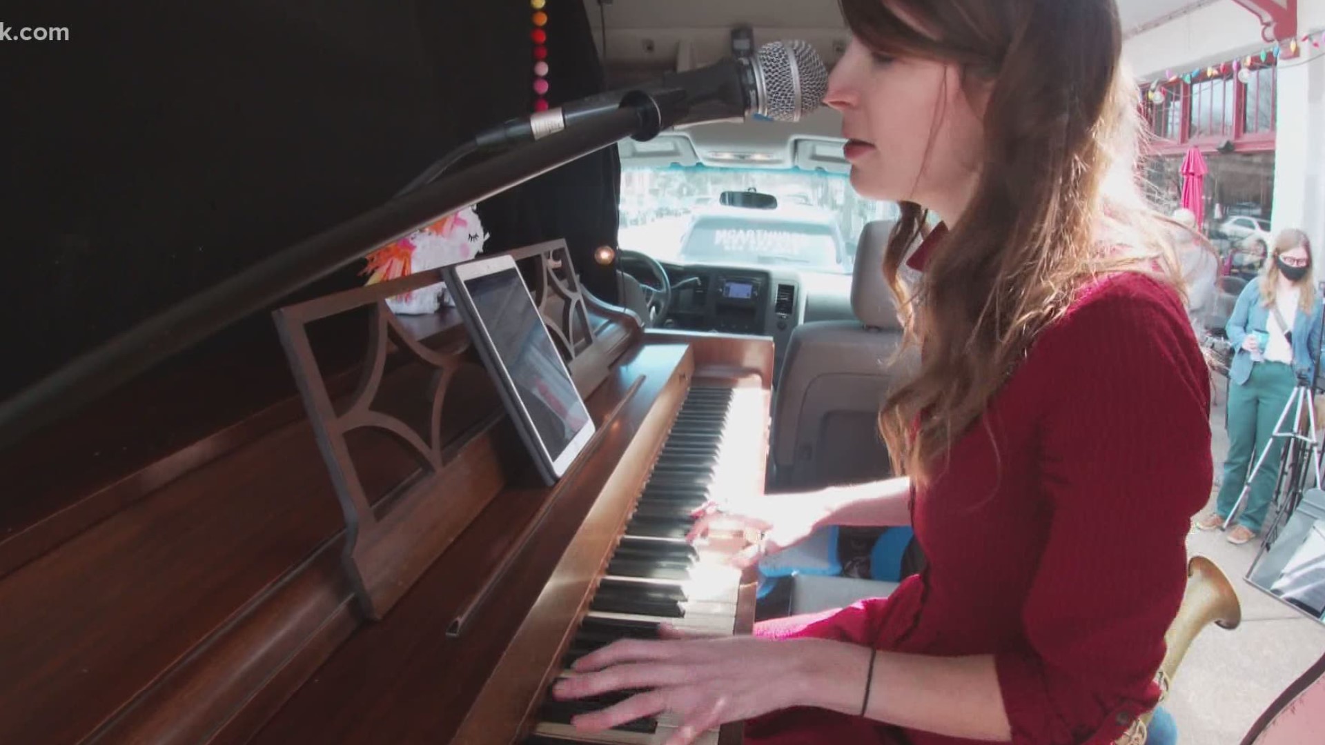 People are finding ways to help one another get through the pandemic. Jackson Pianos is taking its show on the road, raising money and lifting spirits through music
