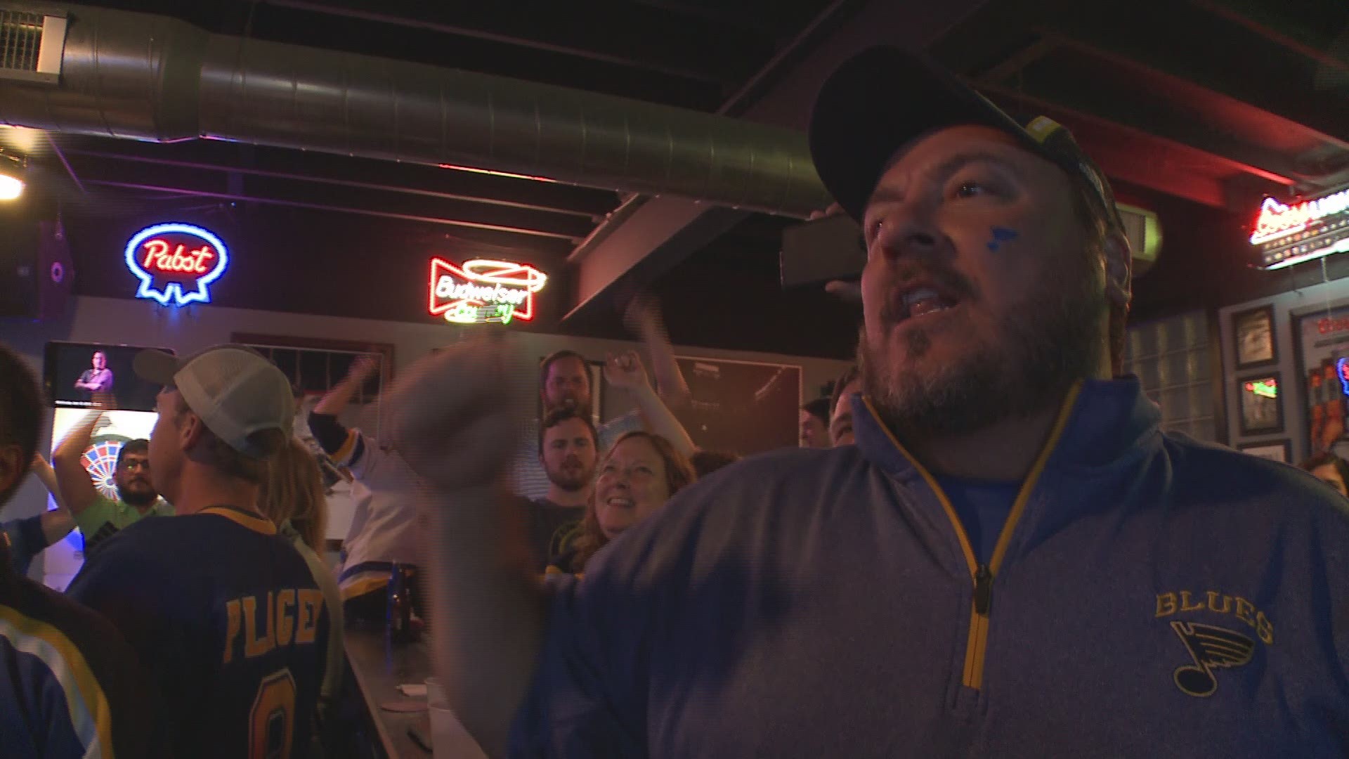 Fans at Bobby's Place in St. Louis react to the Blues’ two first period goals of Game 7 against the Boston Bruins.