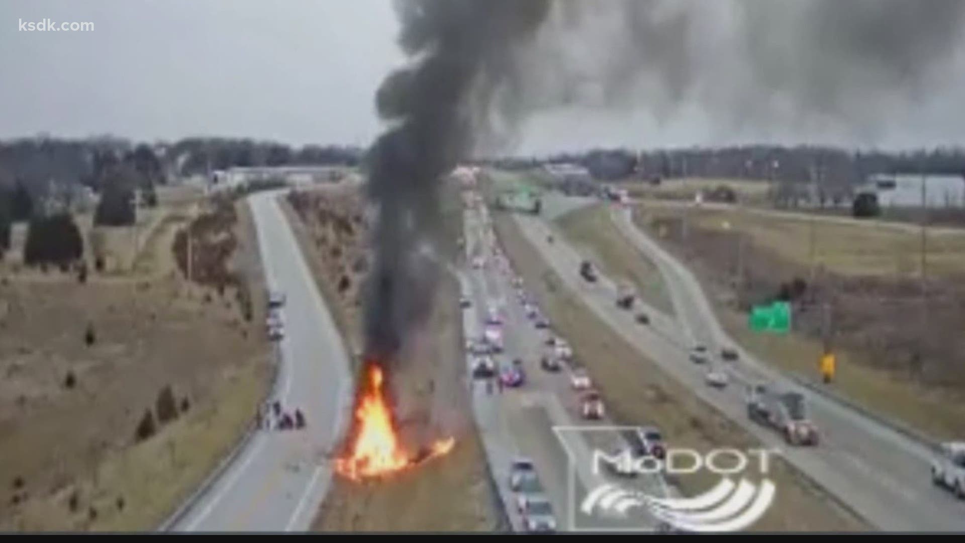 Traffic cameras from MoDOT showed large flames coming out of the vehicle, which came to a stop in a grassy median between the interstate and outer road