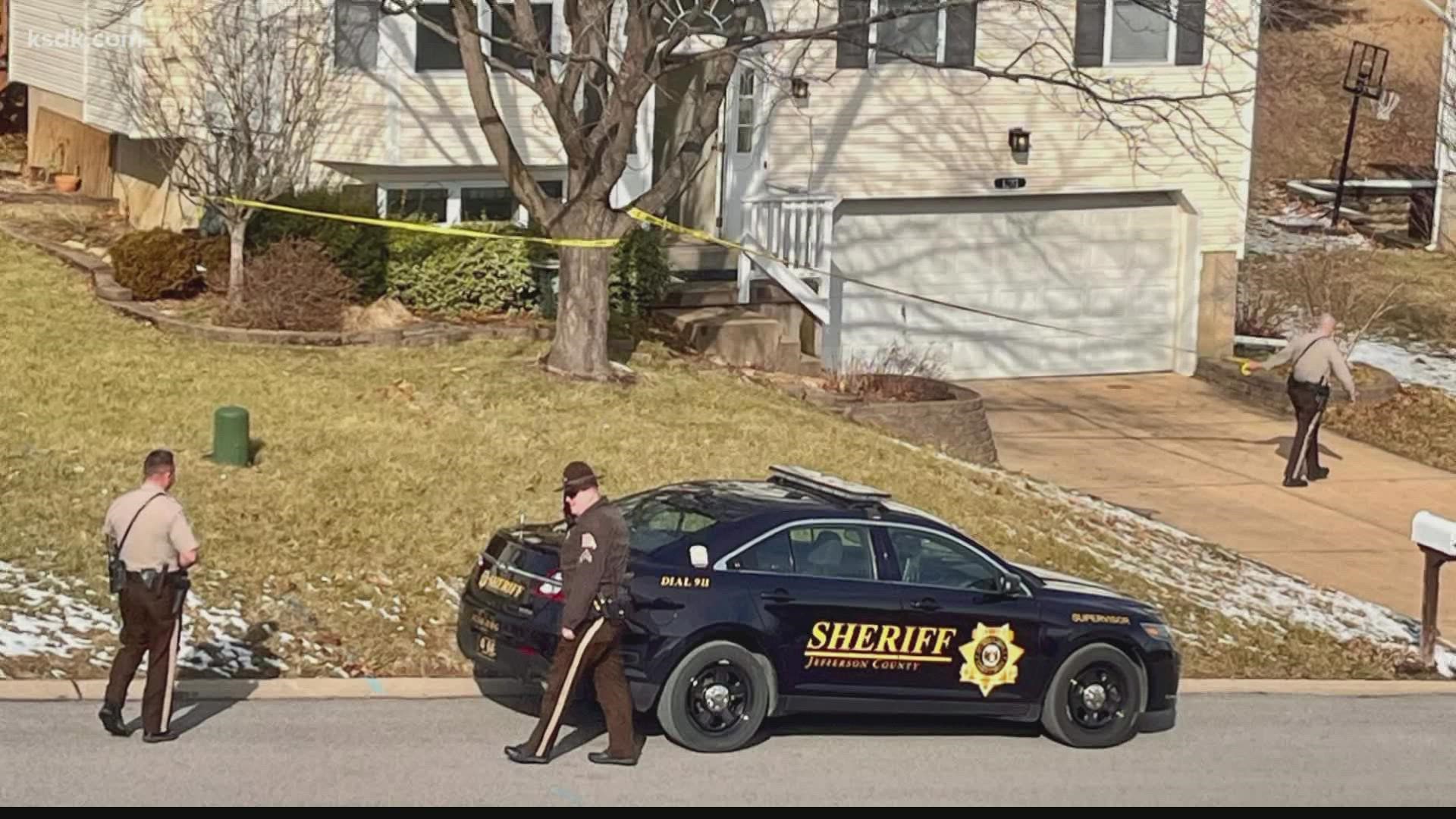 Deputies found a man with a gun in his hand and a woman both shot dead inside a home in Jefferson County.
