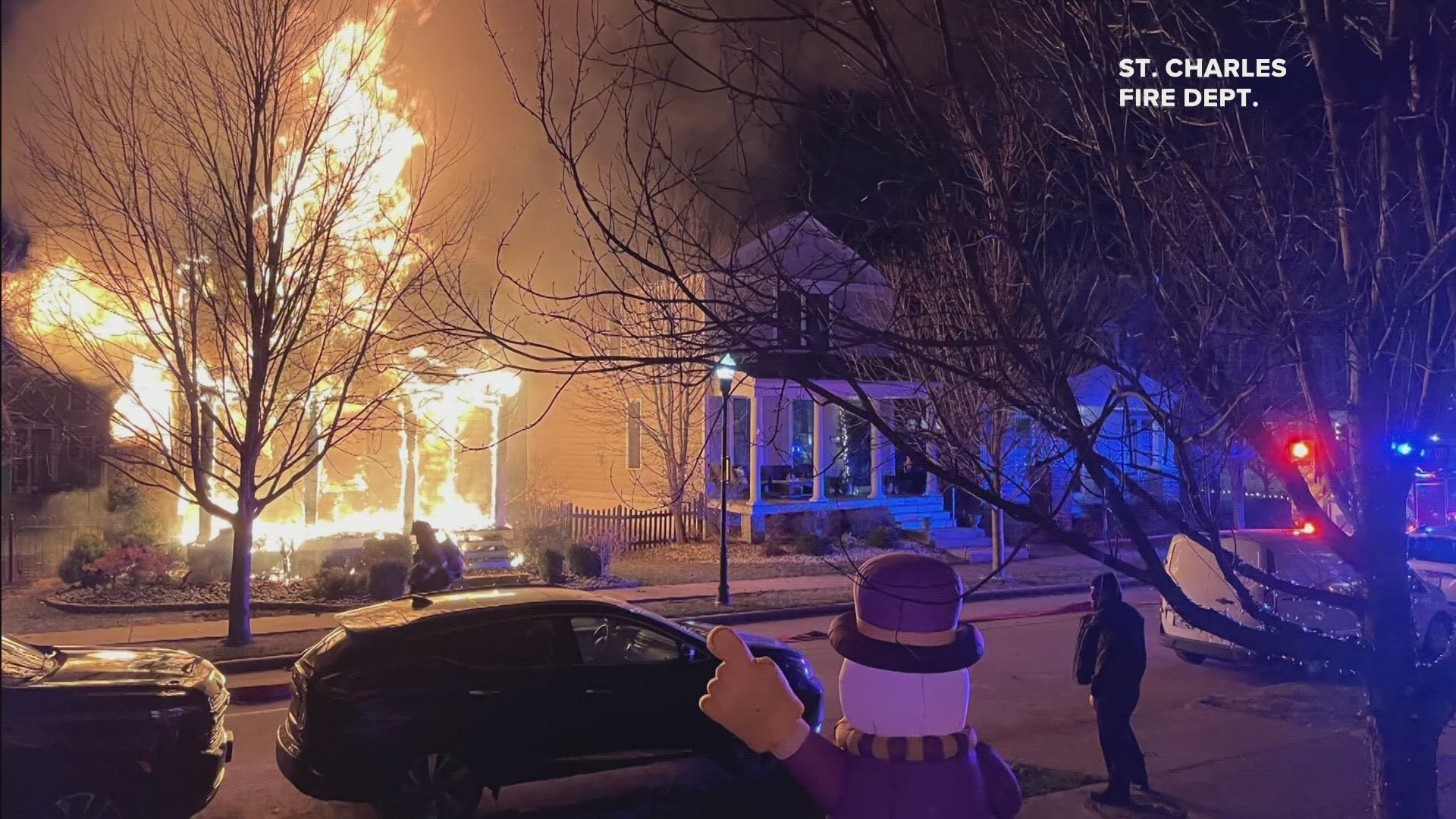 Fire destroyed a two-story home in the New Town of St. Charles development. One resident suffered minor injuries.