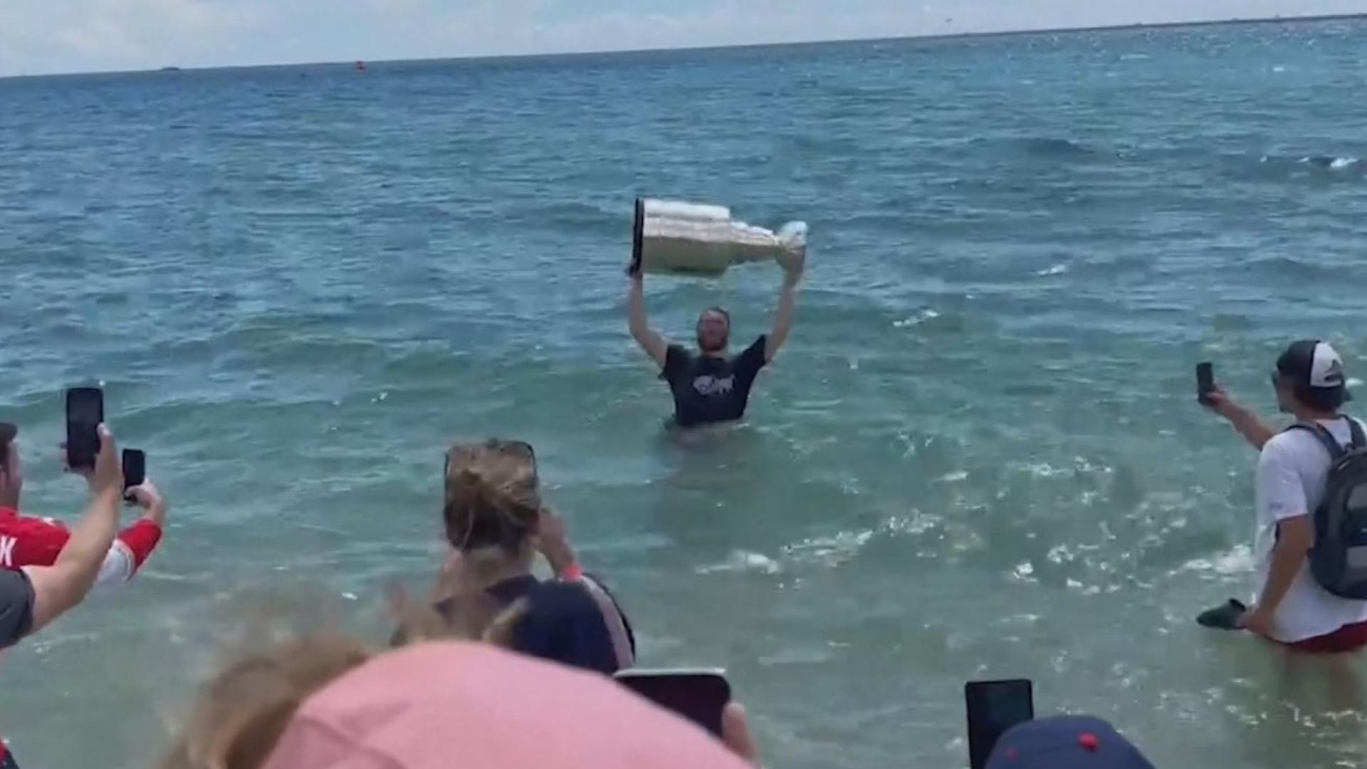 Florida Panthers star Matthew Tkachuk took a dip in the Atlantic Ocean with the Stanley Cup Tuesday. The team won its first championship on Monday. (WTVJ)