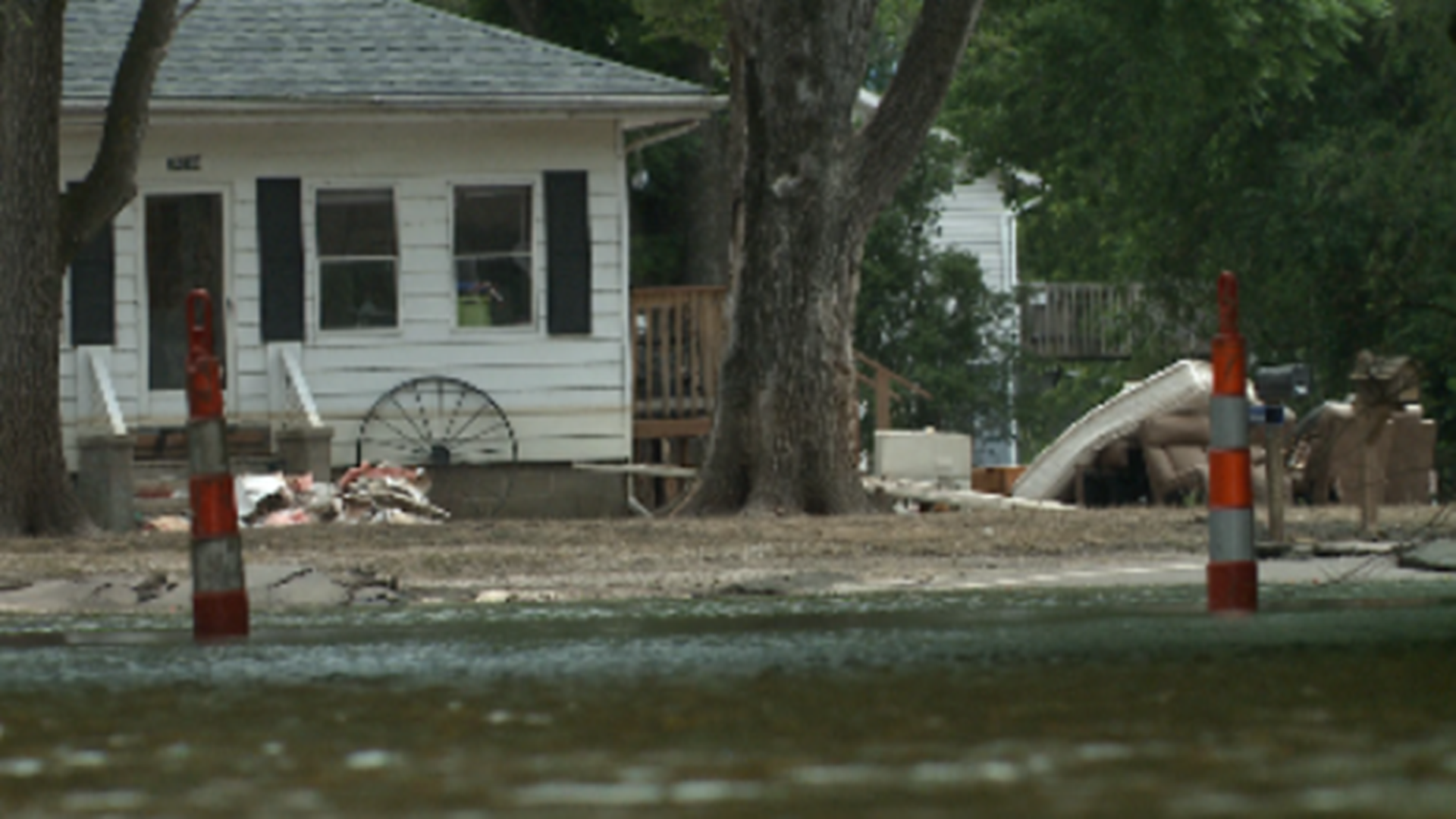 The mayor says the town is at a standstill, stuck in between rising waters and recovery efforts.