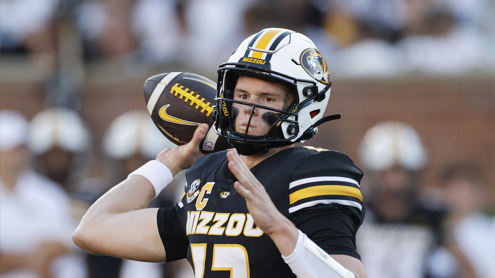 Brady Cook threw for 228 yards and ran for two touchdowns, preseason All-American Luther Burden III also scored, and No. 9 Missouri routed Buffalo 38-0.