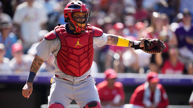 Puerto Rico's catcher Yadier Molina (4) chases down Japan's
