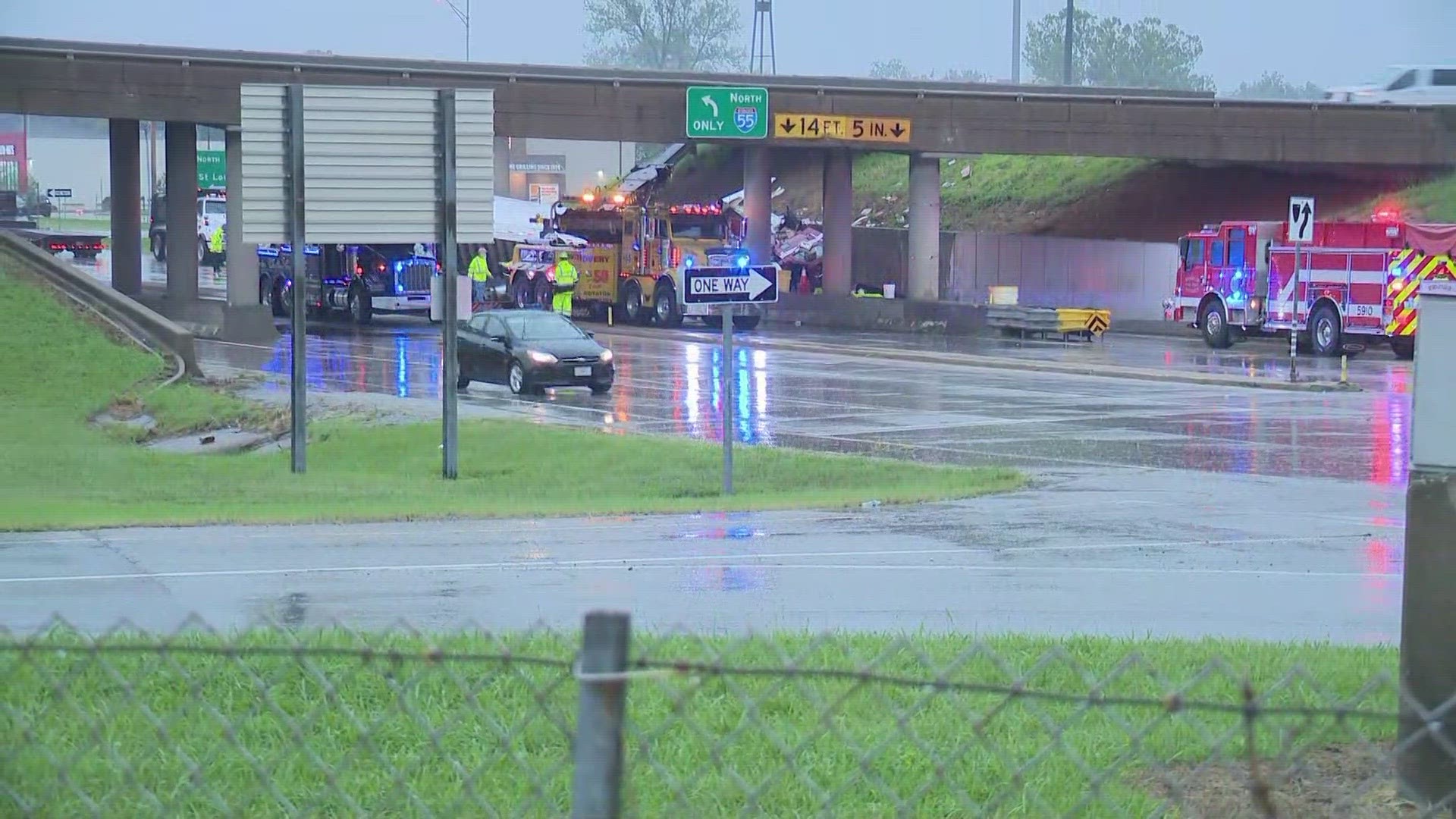 Traffic snarls on Highway Z as crews work to remove a semi truck overturned early Wednesday morning.