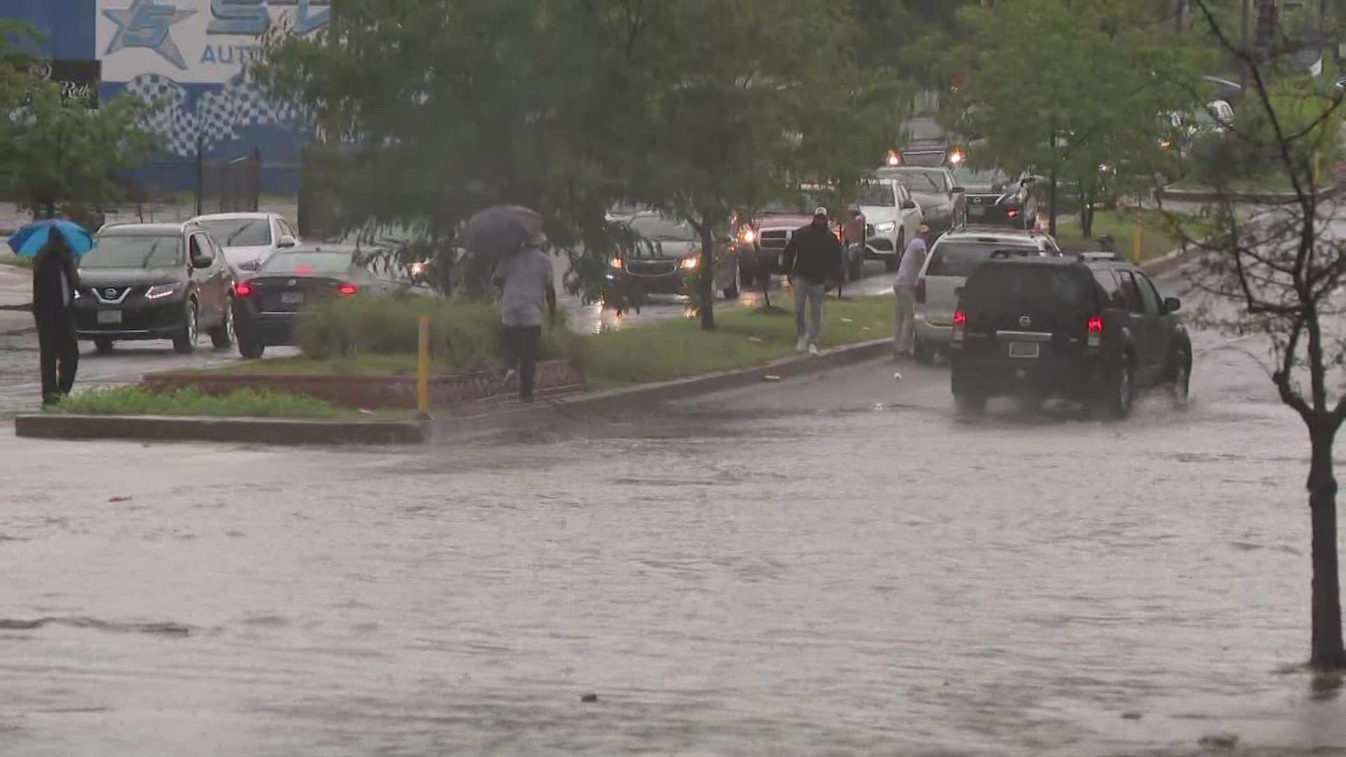 As some cars were stuck in the roadway, others were still trying to drive through. Remember: Turn around, don't drown.