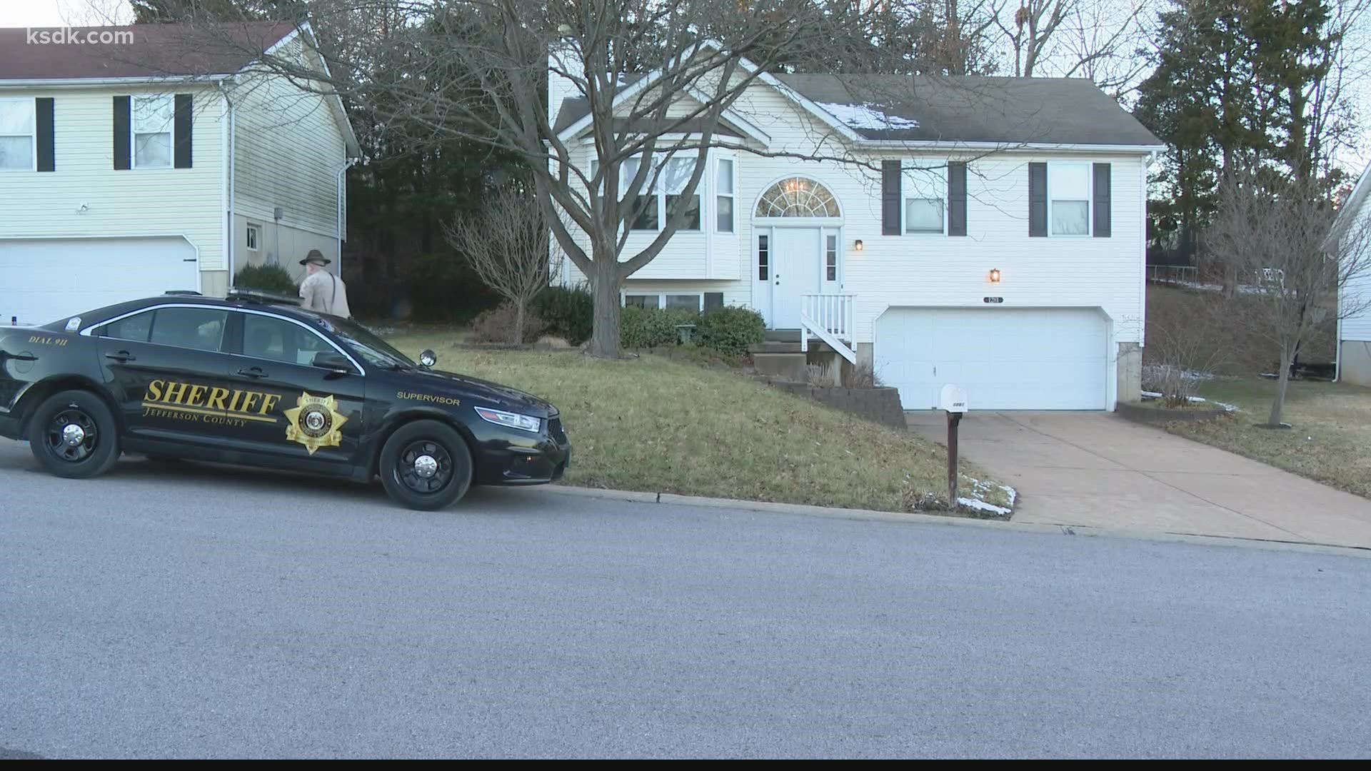 Deputies found a man with a gun in his hand and a woman both shot dead inside a home in Jefferson County.