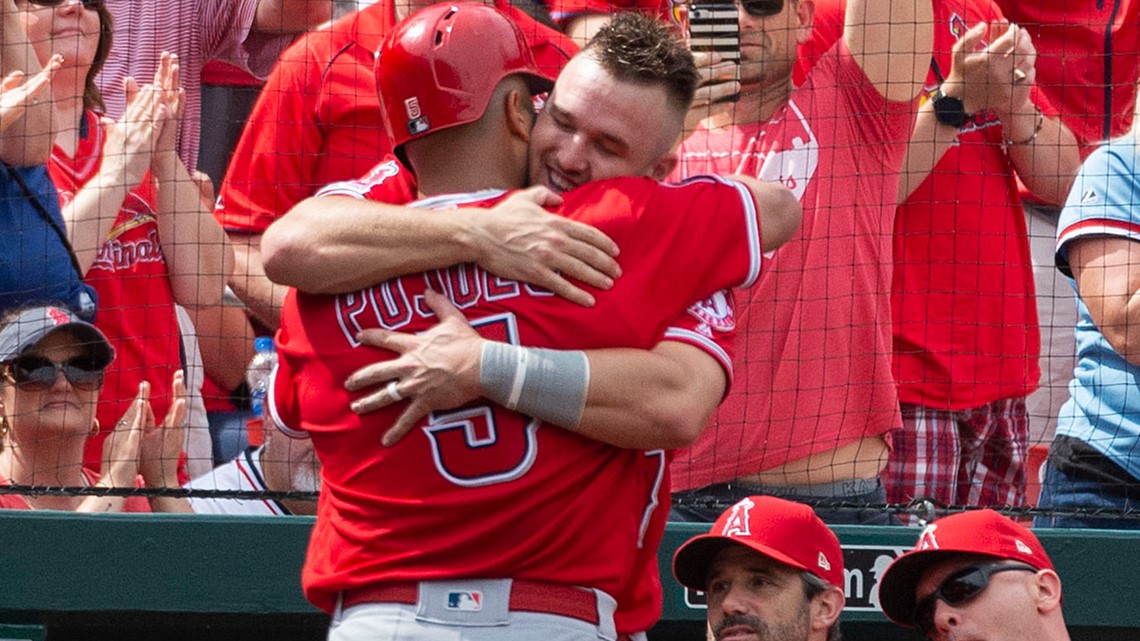 Albert Pujols and Yadier Molina hug at home