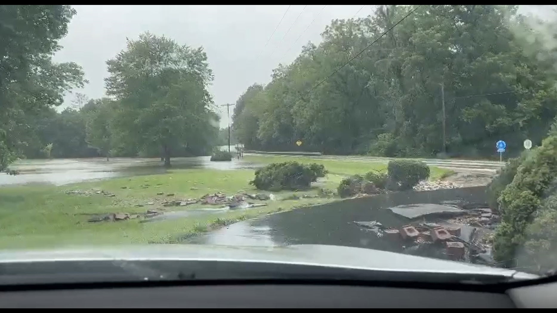 Lloyd Karmeier’s reacted to seeing the damage floodwaters caused to his driveway Tuesday in Nashville, Illinois.