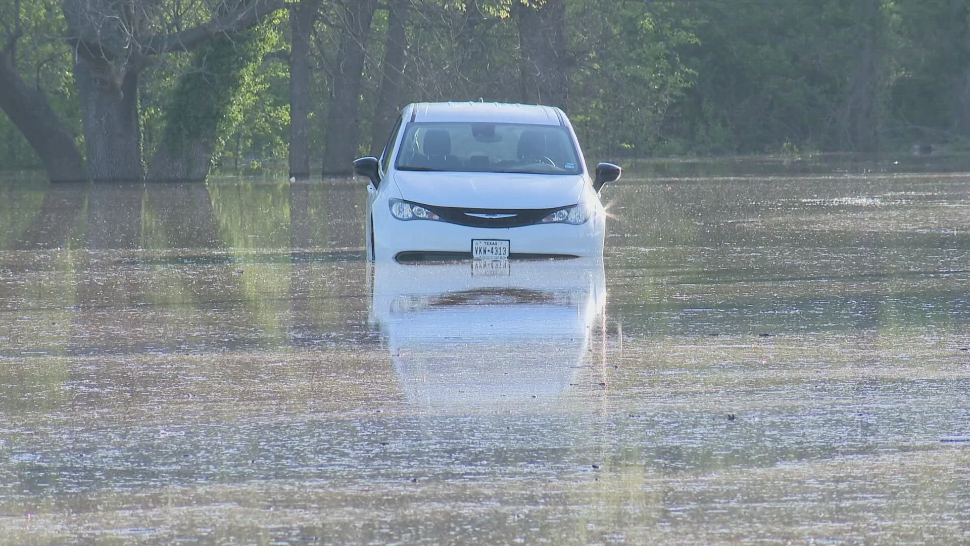 Never drive through standing water. If you encounter a flooded roadway, try to turn around.