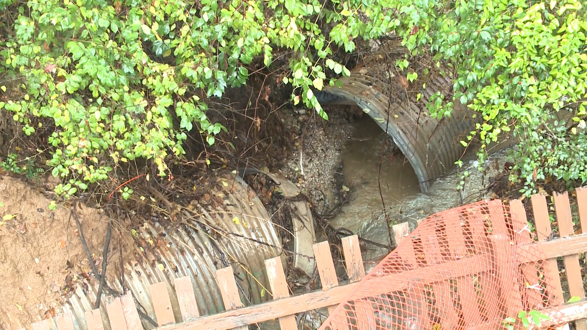 In July, heavy rain ruptured a culvert pipe behind a home in Woodridge Estates. Rain washed out a large section of the land around the pipe.