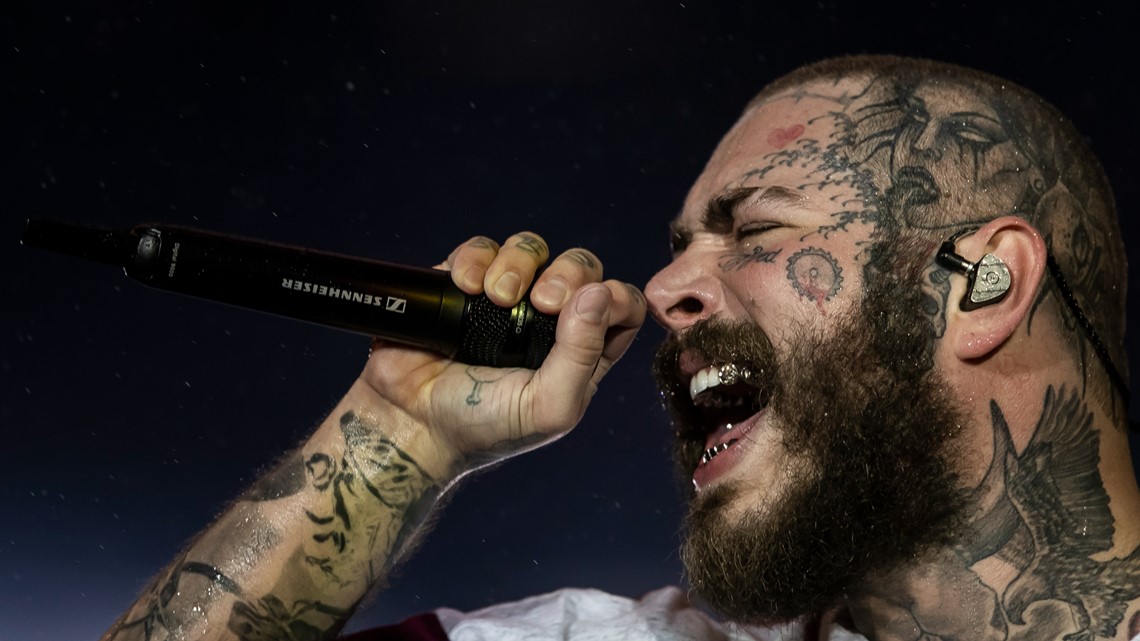 Rapper Post Malone falls on stage during concert in St. Louis, gives