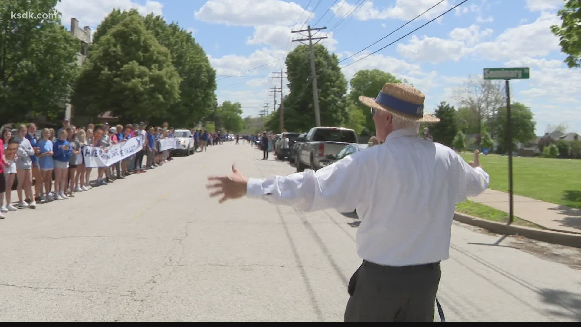 Students lined up along Slaughter’s route with signs cheering “thank you” and “goodbye”